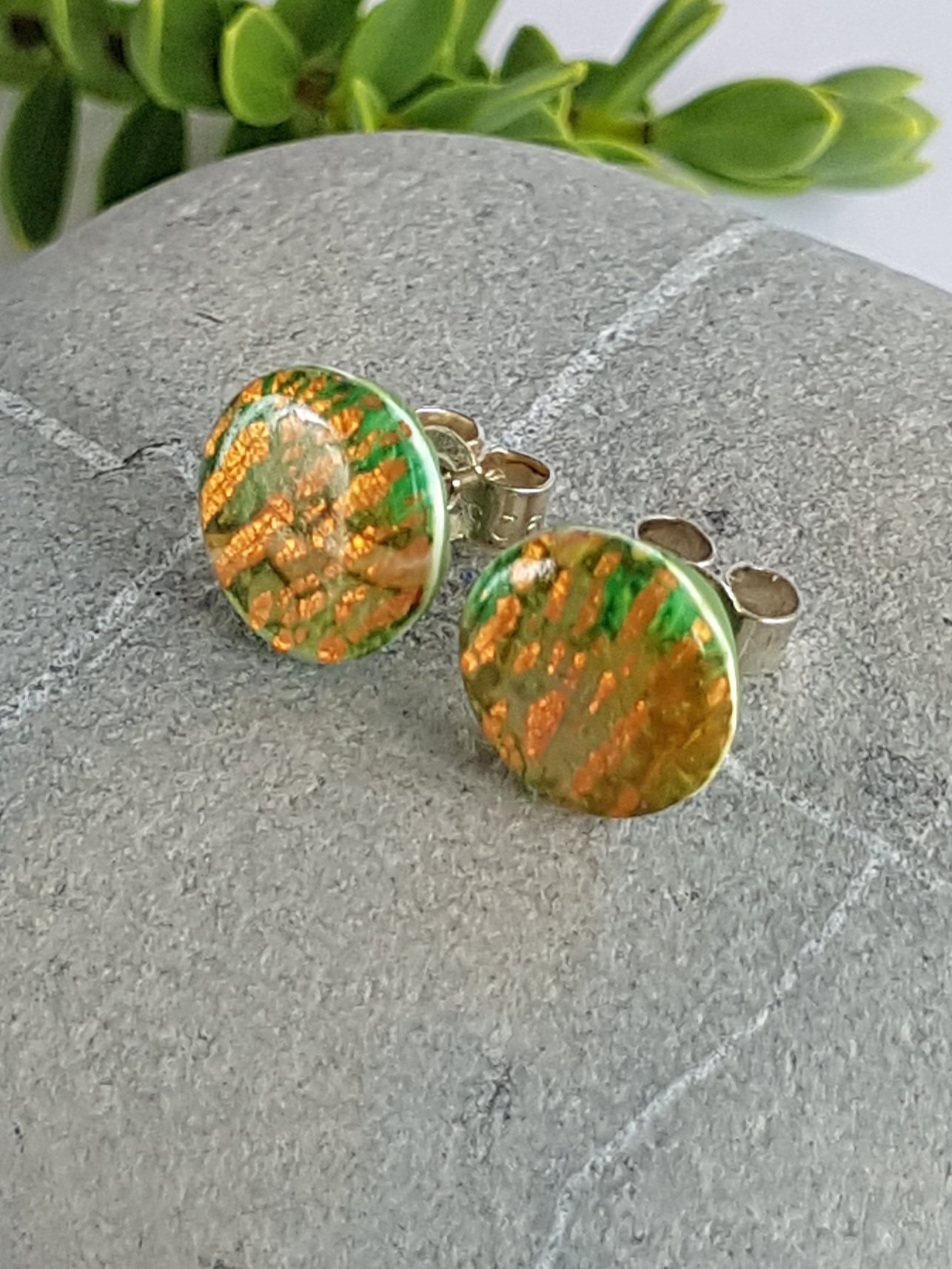 Green and gold-colour round polymer clay stud earrings with sterling silver posts and scrolls.