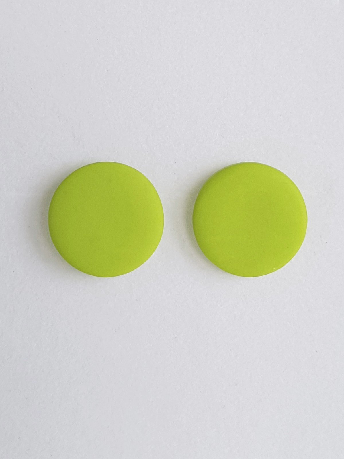 Lime green round stud earrings made with polymer clay and sterling silver available in 6, 9, 13 or 16 mm diameters.
