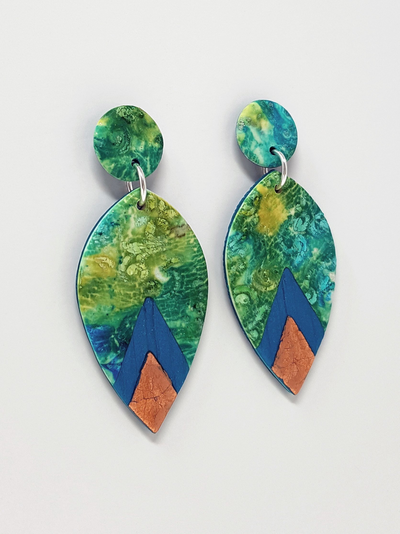Large pointed petal beads hanging from round stud top beads, in teal, turquoise, yellow with peacock and faux bronze diamond tips.