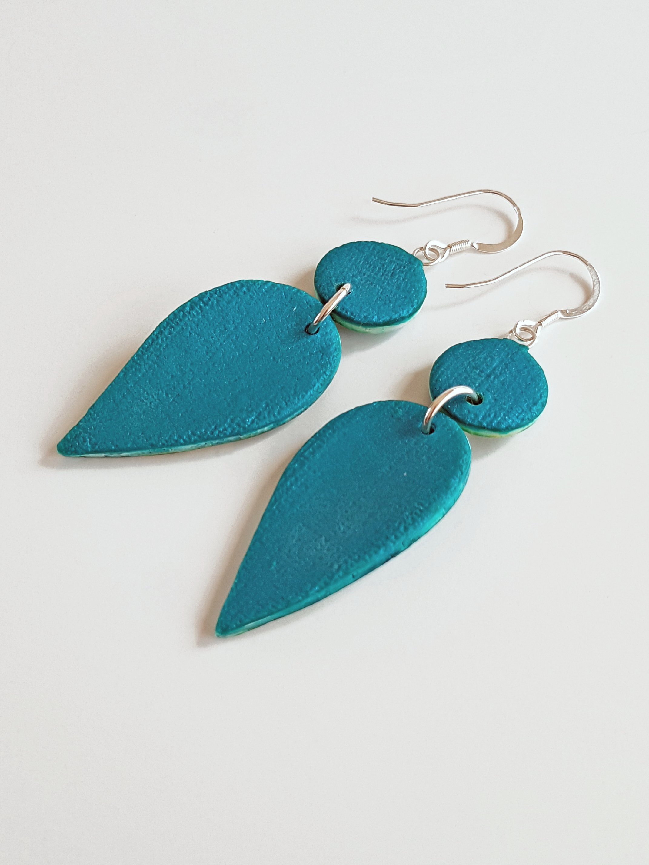 Back of Kalamata Petals, small, earrings, showing pearly peacock backs, gently curved profile and sterling silver ear wires.