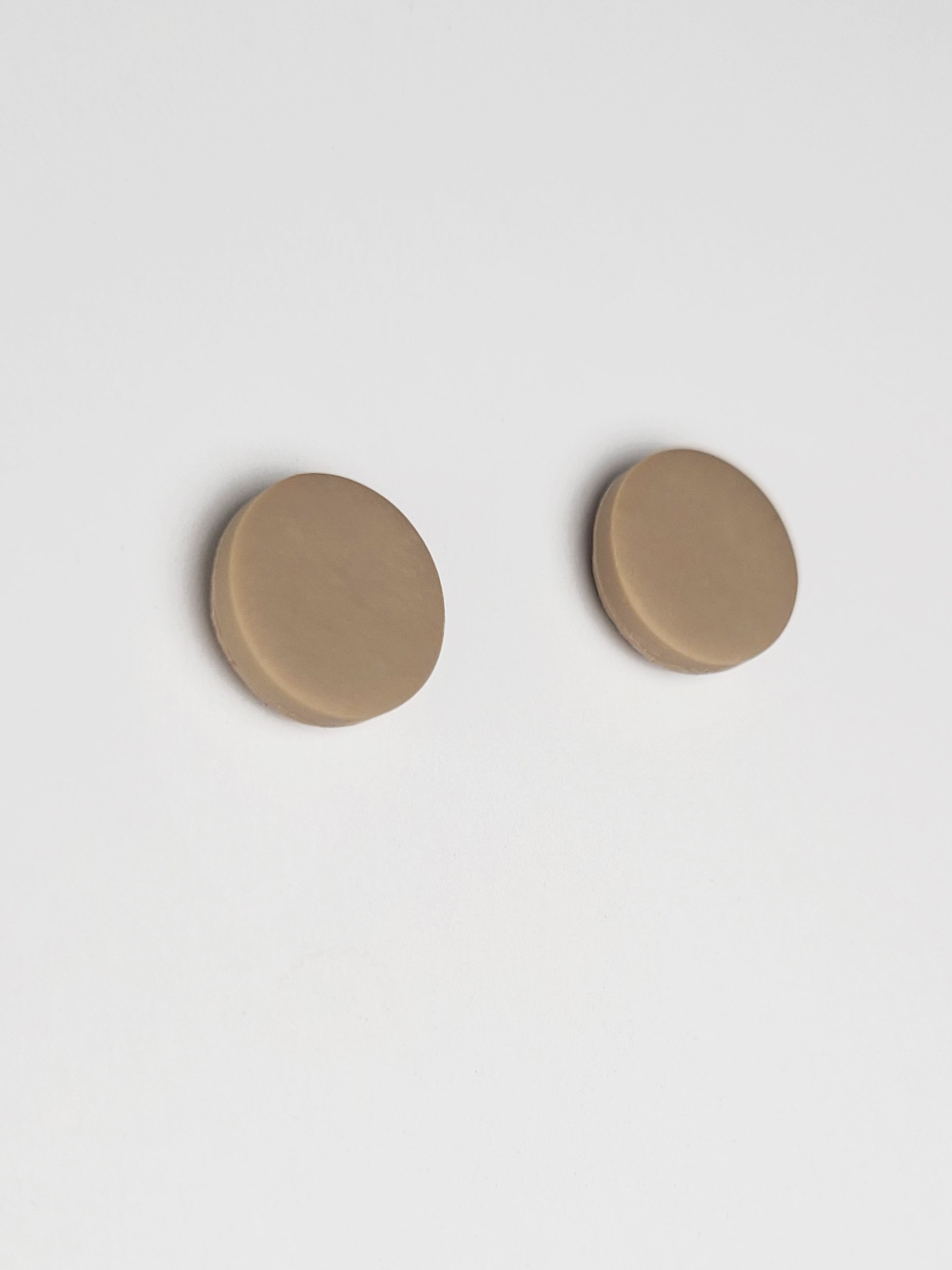 Mushroom grey round stud earrings with a smooth matte finish made with polymer clay and sterling silver posts and scrolls.