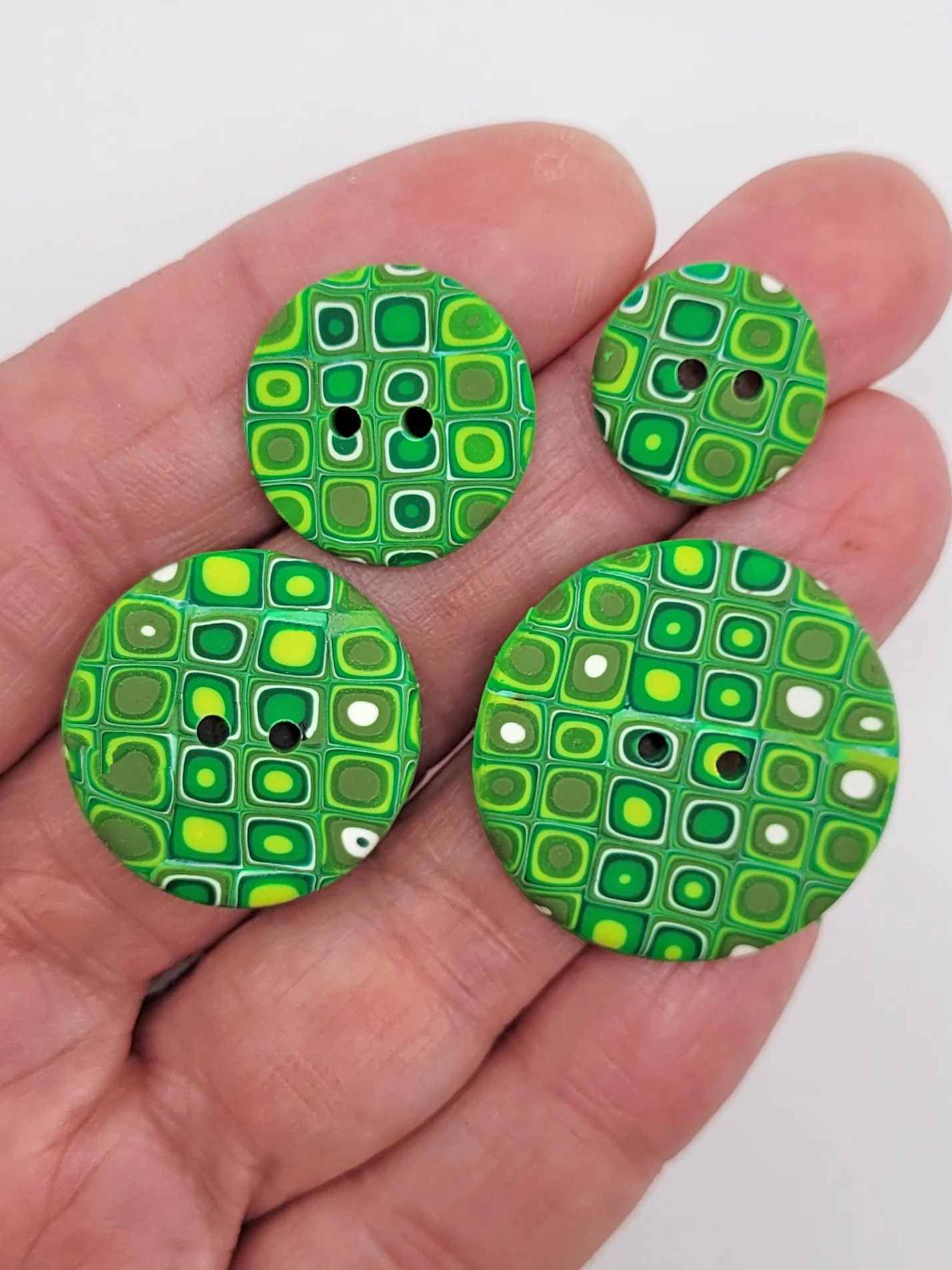 Klimt inspired green and lime buttons in four different sizes.