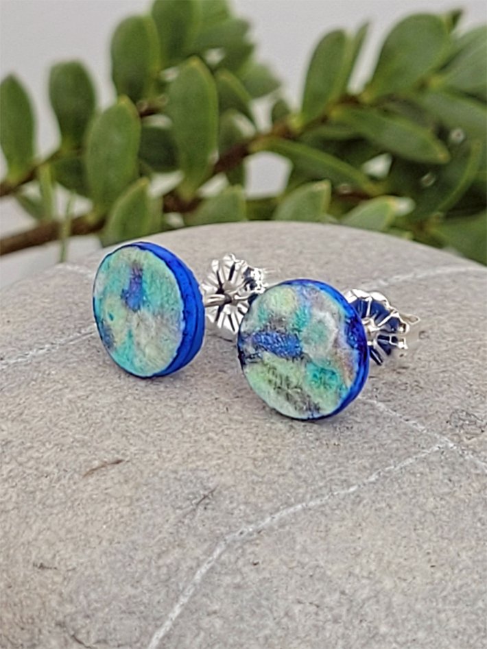 Blue and pastel green studs with royal blue edges and backs and sterling silver posts and scrolls.