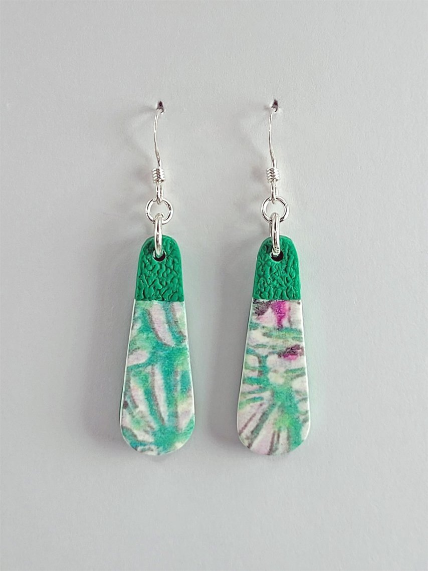 Option 3, teardrop-shaped earrings with pastel floral design in pink, mauve, white, green and grey, featuring a green textured upper segment, shown face-on.