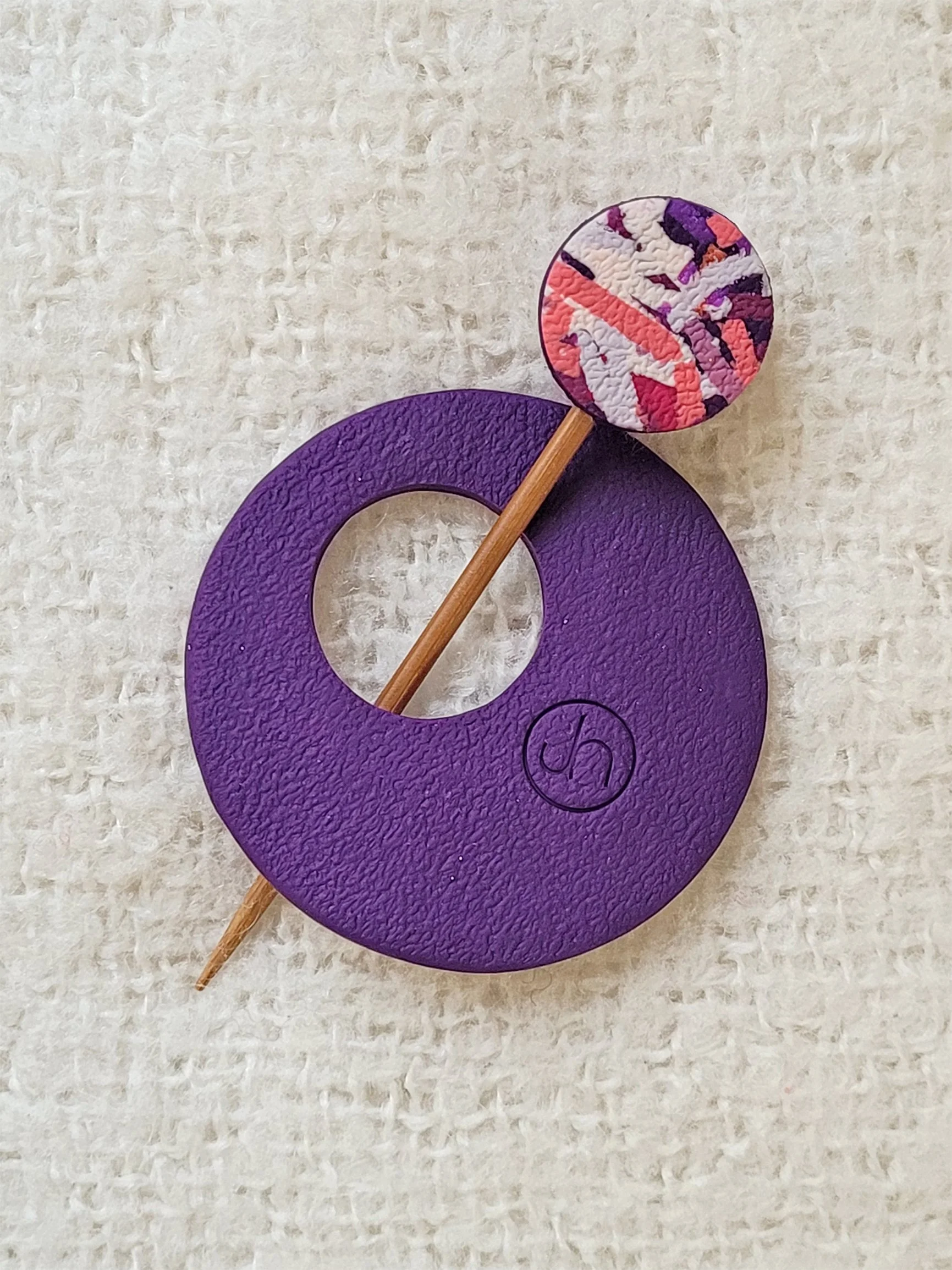 Textured purple back of Purple Ticker Tape Pin, with colourful round top to the bamboo pin.