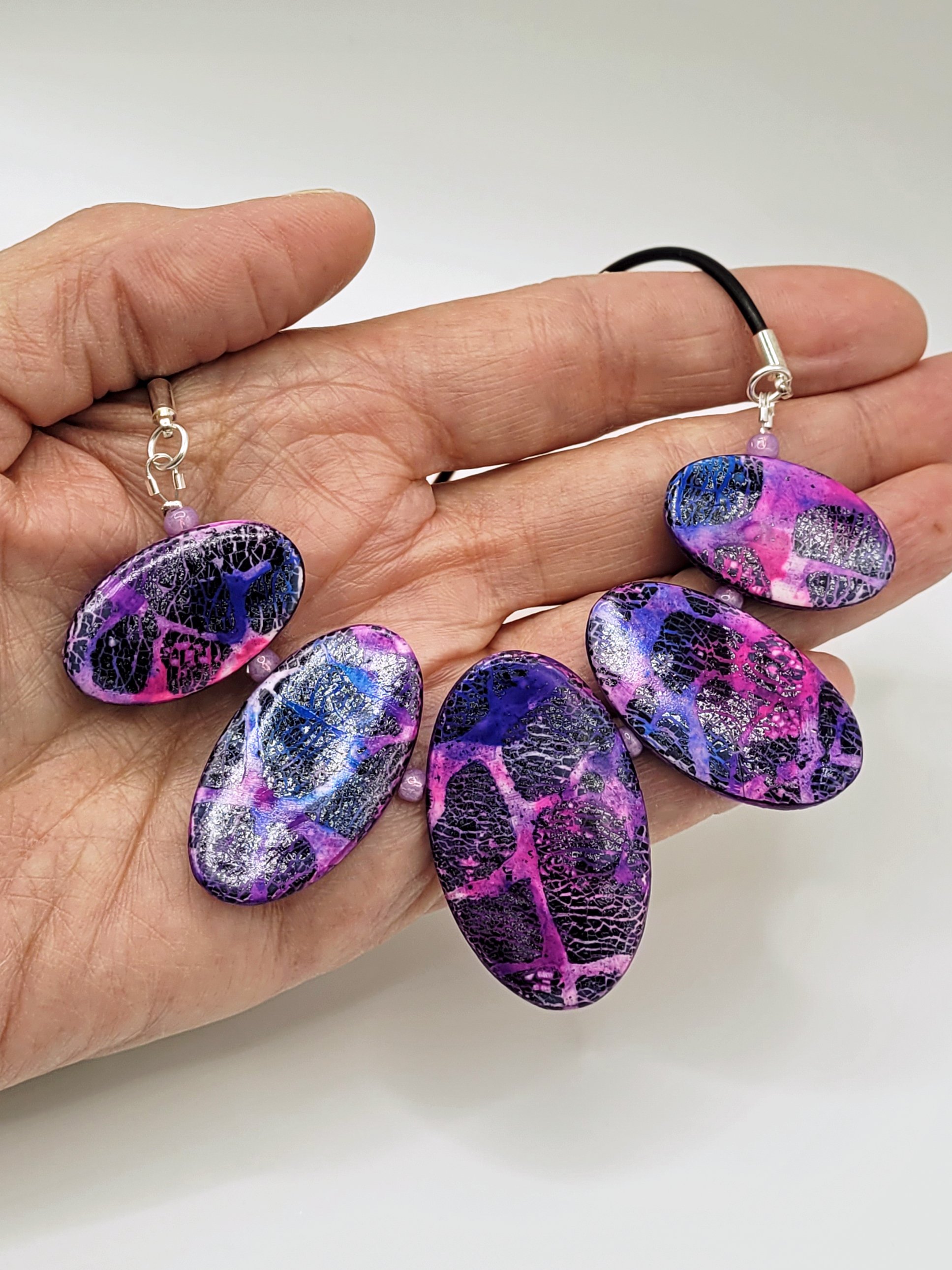The 5 bead section spans approximately 11 cm and sits comfortable across the palm of a hand.