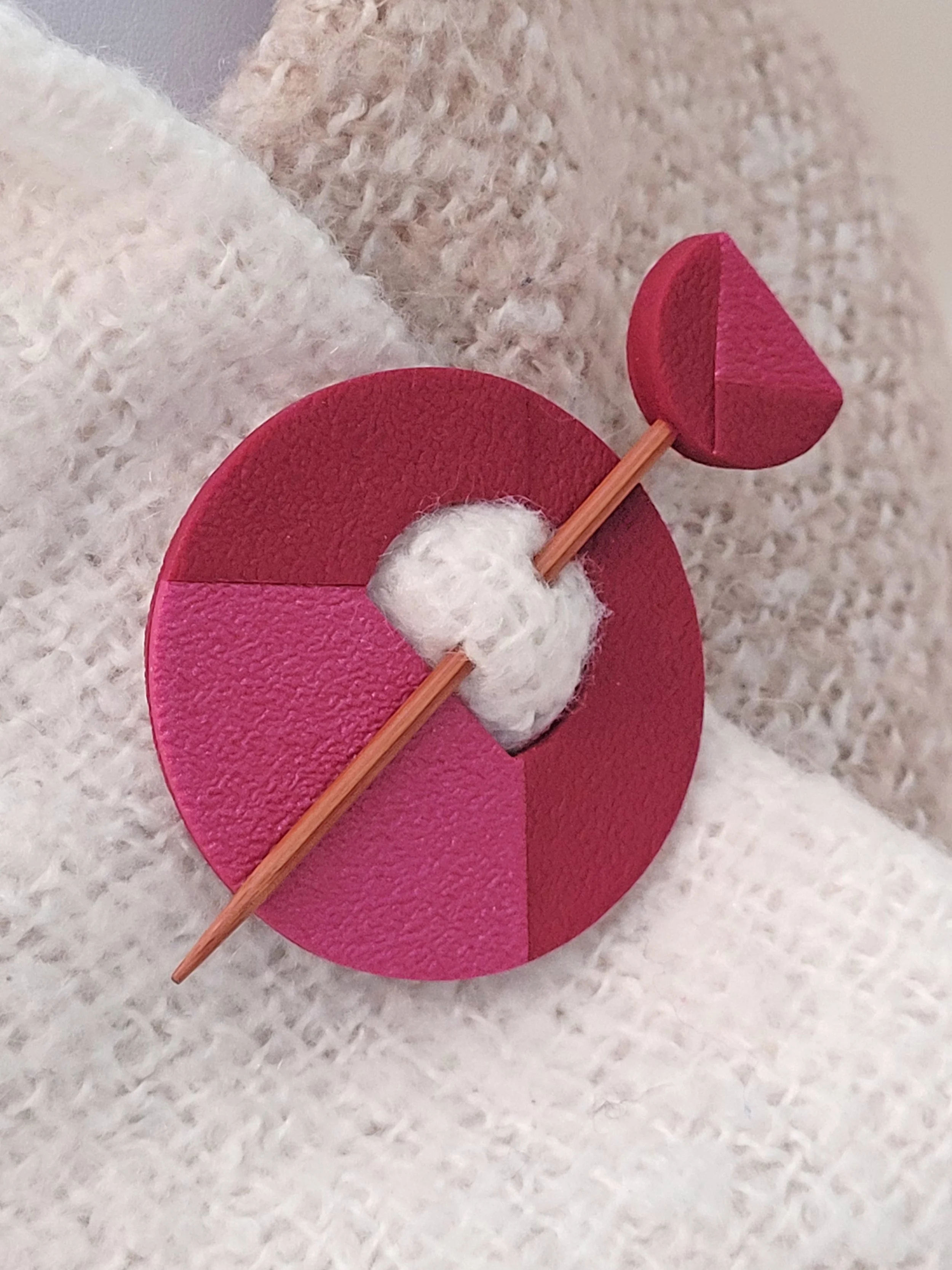 The Two Tone Wine pin features a pearlescent lower left quadrant and two cut layers of the darker red tone.