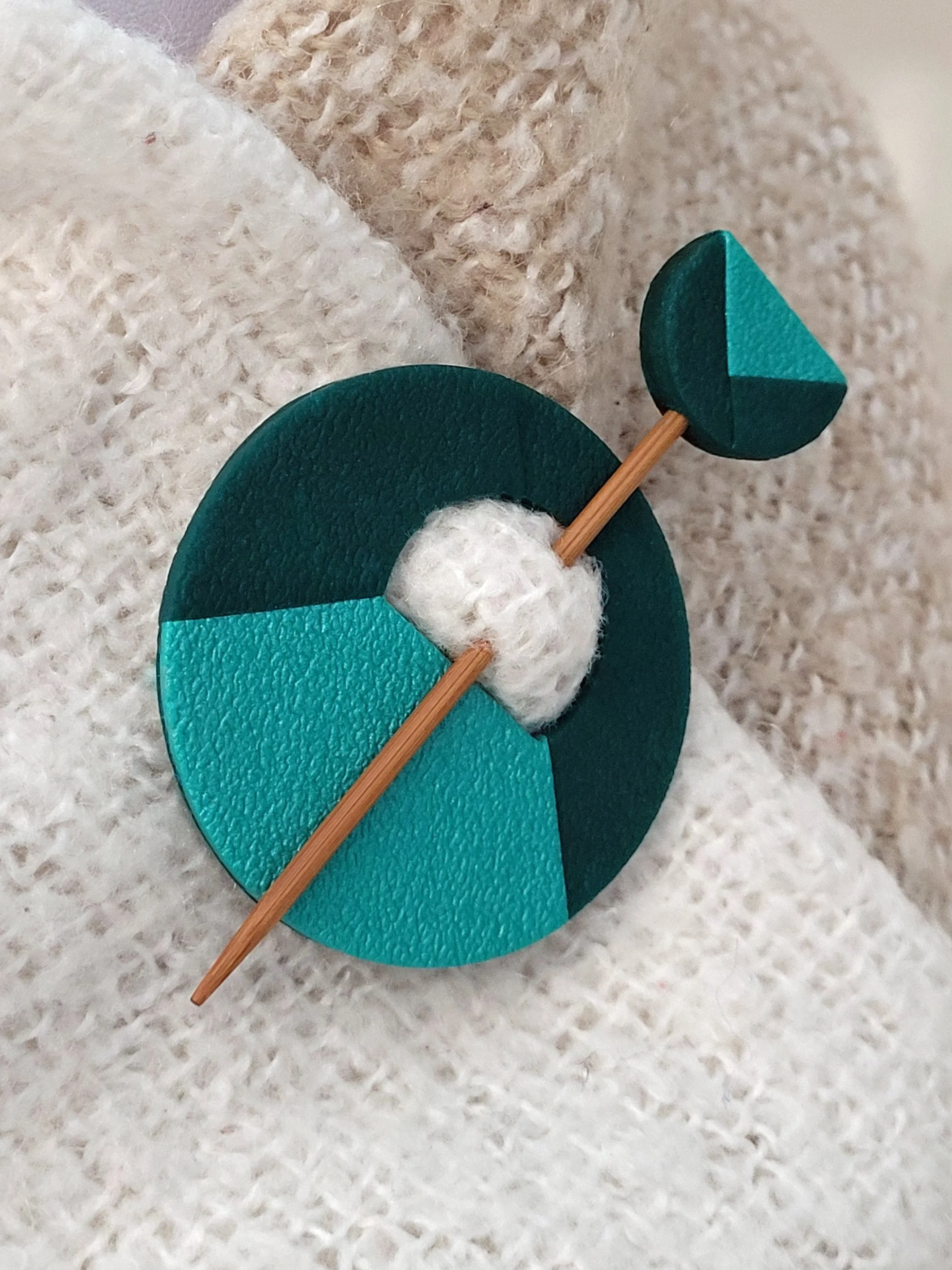 The Two Tone Green pin features a pearlescent lower left quadrant and two cut layers of the darker mossy green tone.