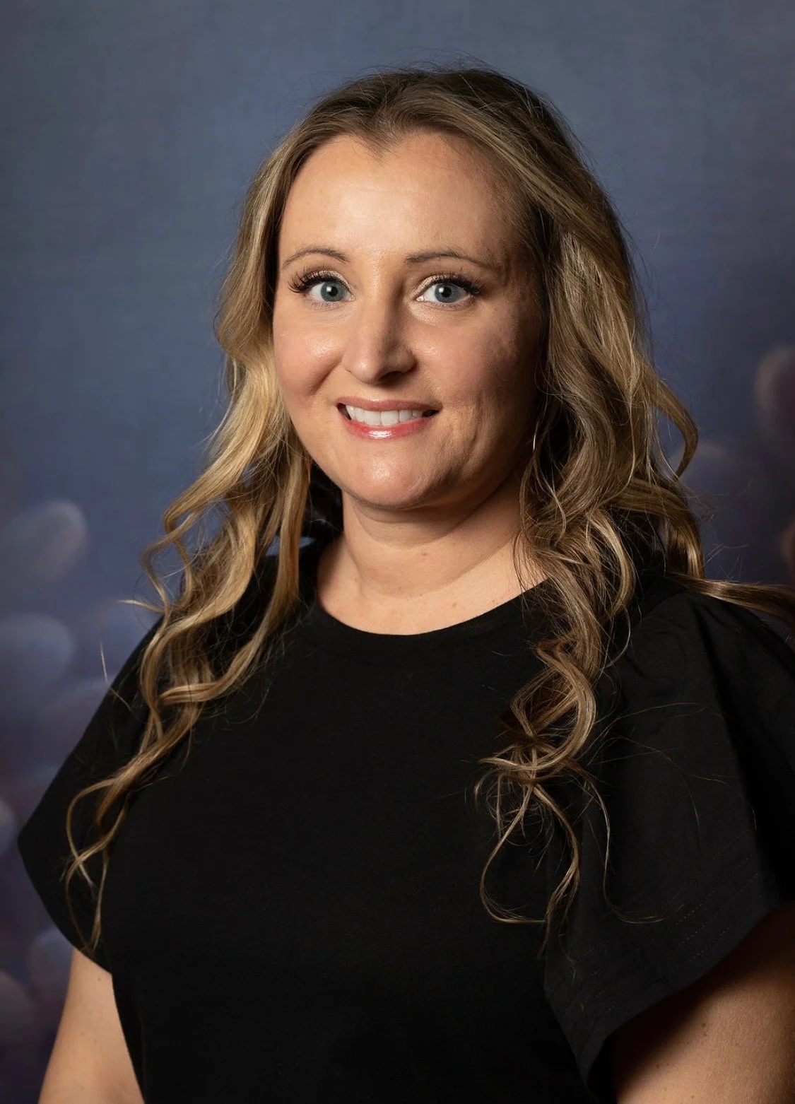 Adrienne Head Shot Purple.JPG