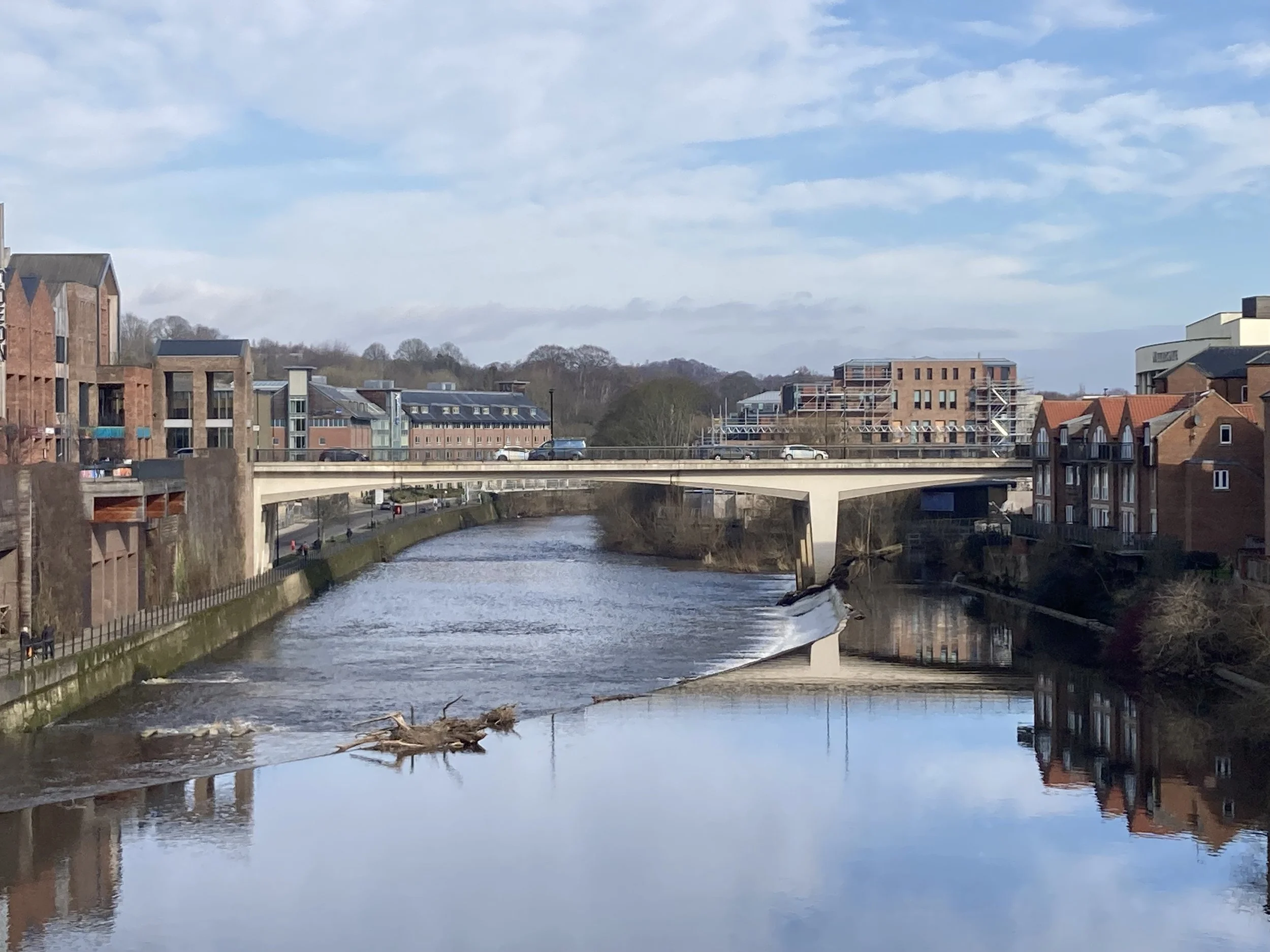 A view across a weir to Milburngate bridge