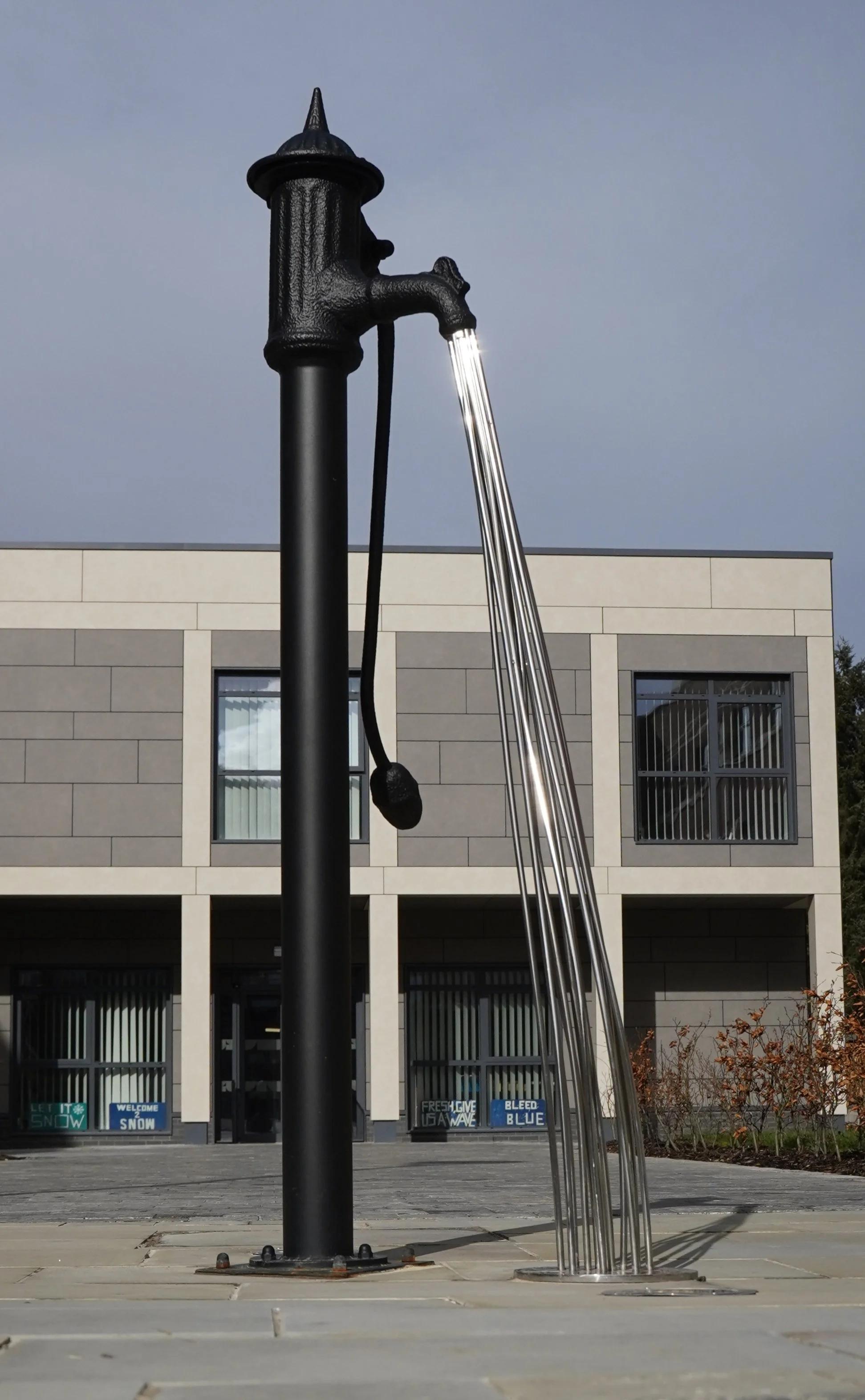 Sculpture of a pump and water