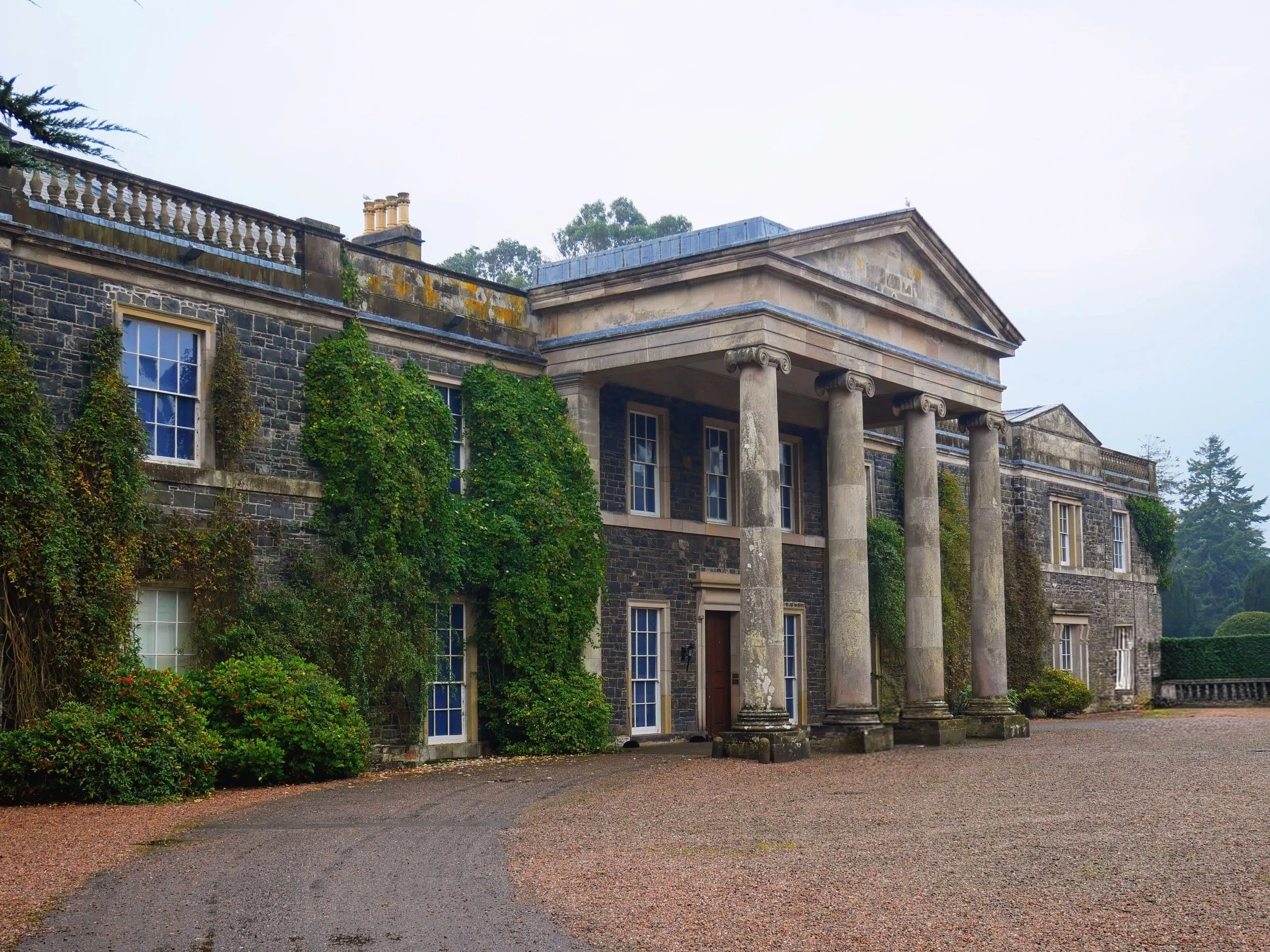 A view of the front entrance of Mount Stewart, the Londonderry seat in Northern ireland, showing a four column portico