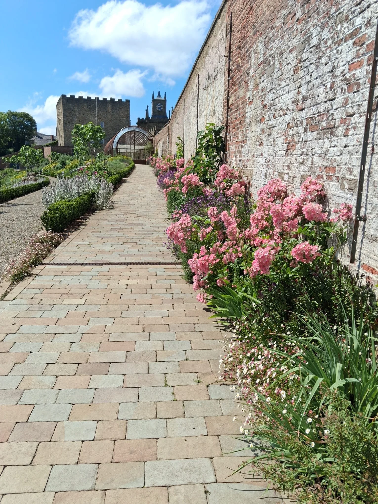 The top terrace of the Walled Garden looking towards the glasshouse.