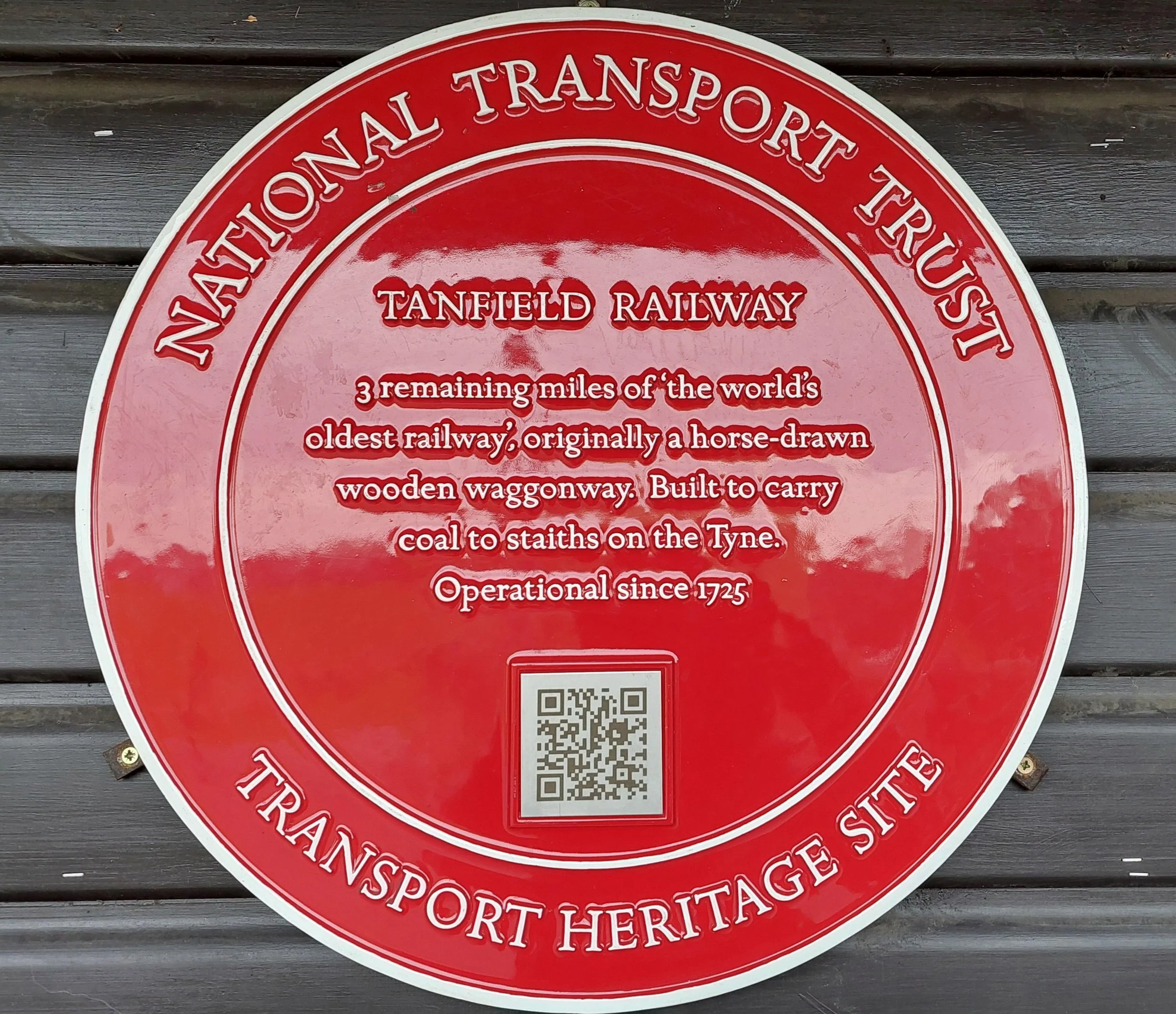 Plaque which says 3 reamining miles of the world's oldest railway.