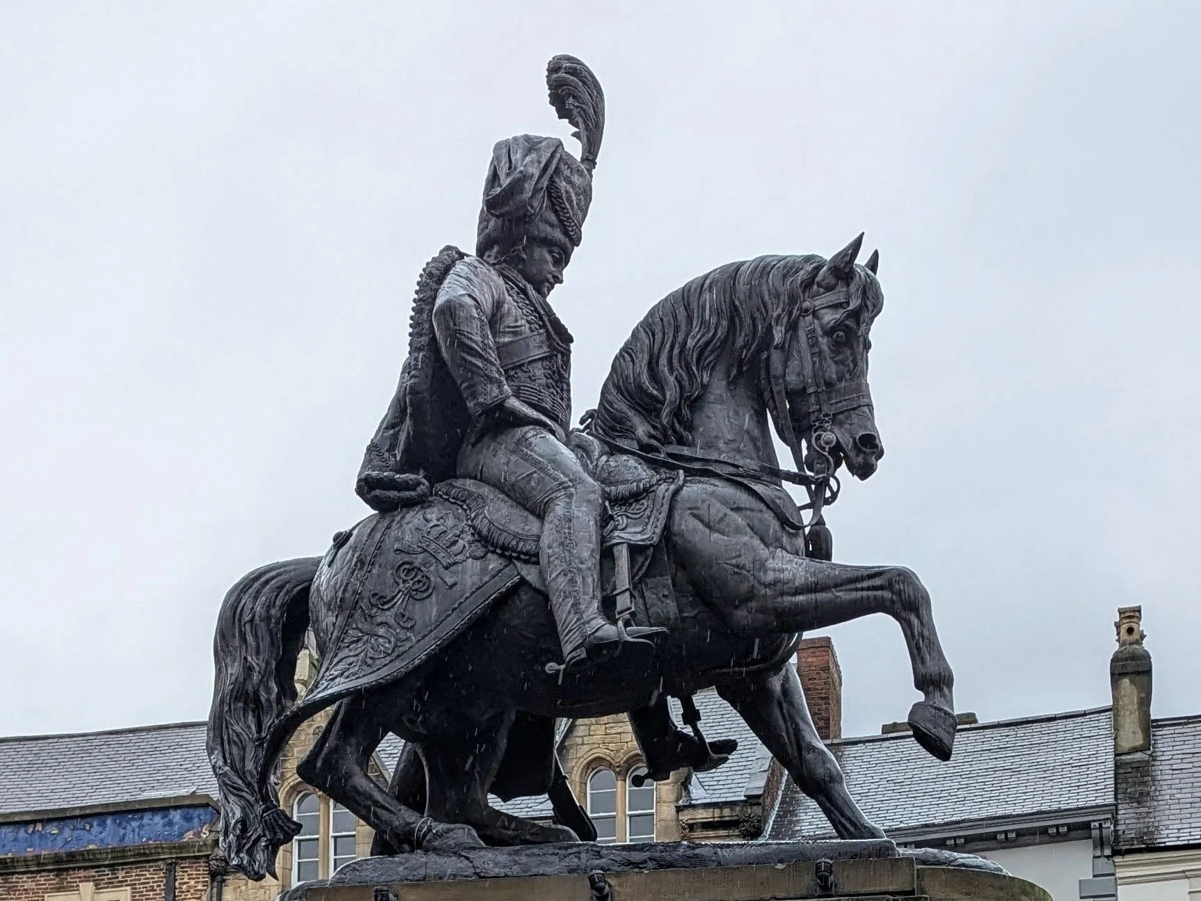 The Marquess of Londonderry ststue in Durham Market Place shoes Charles in his hussar's unifrom seated on a horse with it's right foreleg raised