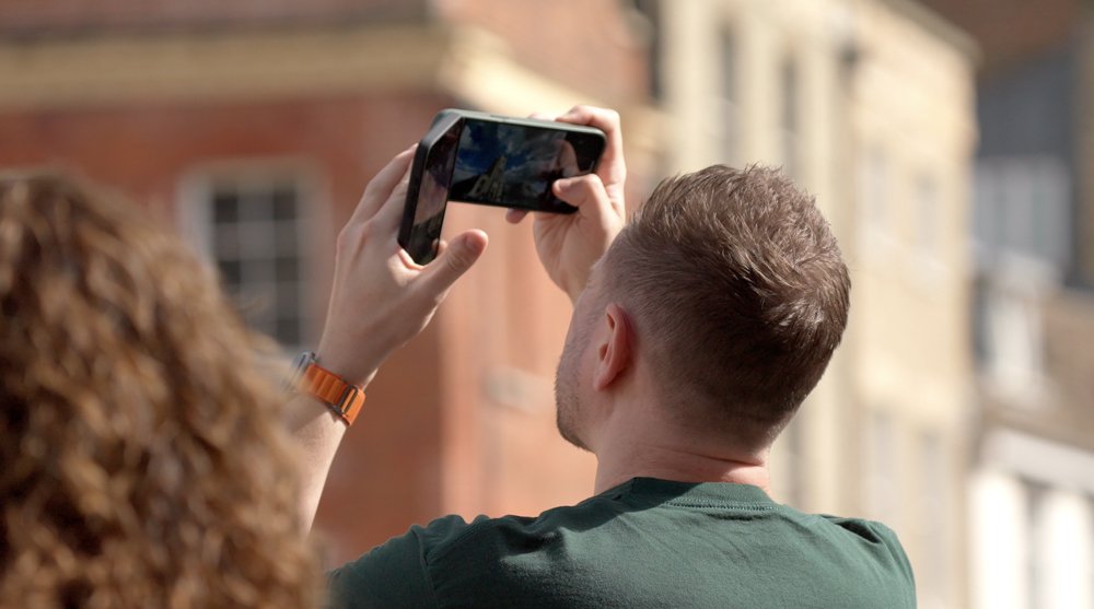 A man taking a phone photo stock video footage