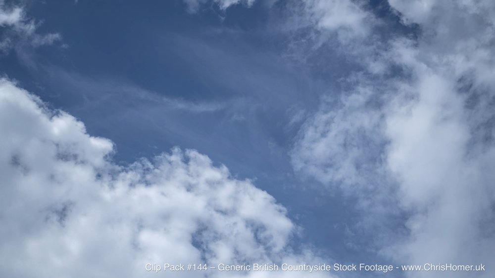 Blue sky and cloud over British countryside