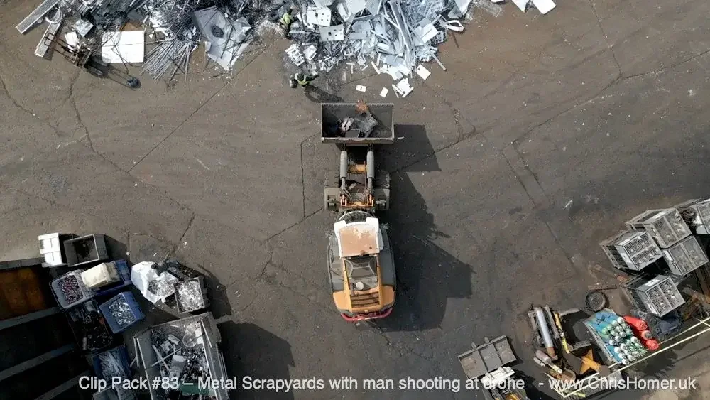 Clip Pack #83 – Metal Scrapyards with Man Shooting at Drone – Stock Video Footage