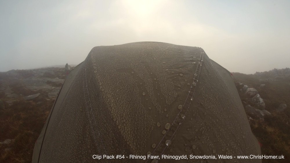 A wet mountain tent in misty weather royalty free stock video footage