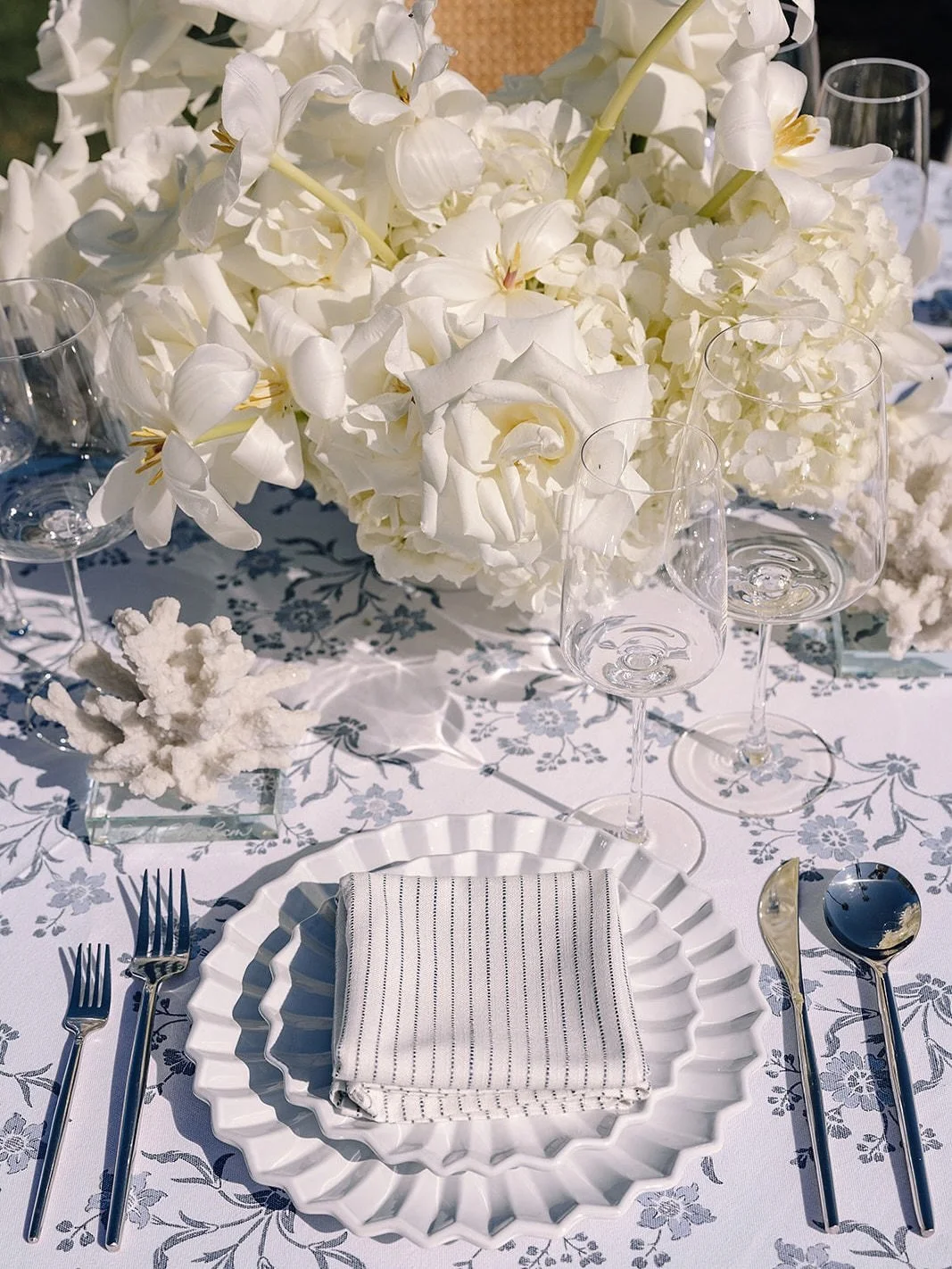 Coastal, but, every detail was considered. 
Blue and white against the Pacific, engraved coral and oyster details, and a cocktail hour designed to feel coastal, personal, and just the right amount of party. When the first night feels this effortless,