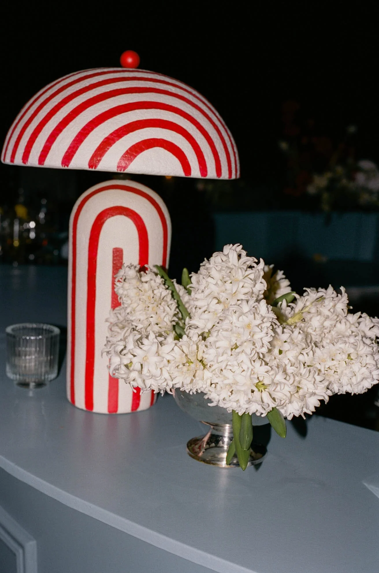 39blue-cocktail-bar-striped-lamp-florals.jpg