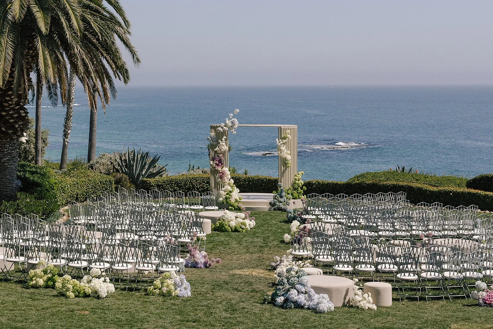 Luxury wedding at Montage Laguna Beach planned by Mandy Marie Events featuring modern summer design, vibrant color palette, and a seamless indoor-outdoor ceremony and reception experience overlooking the ocean