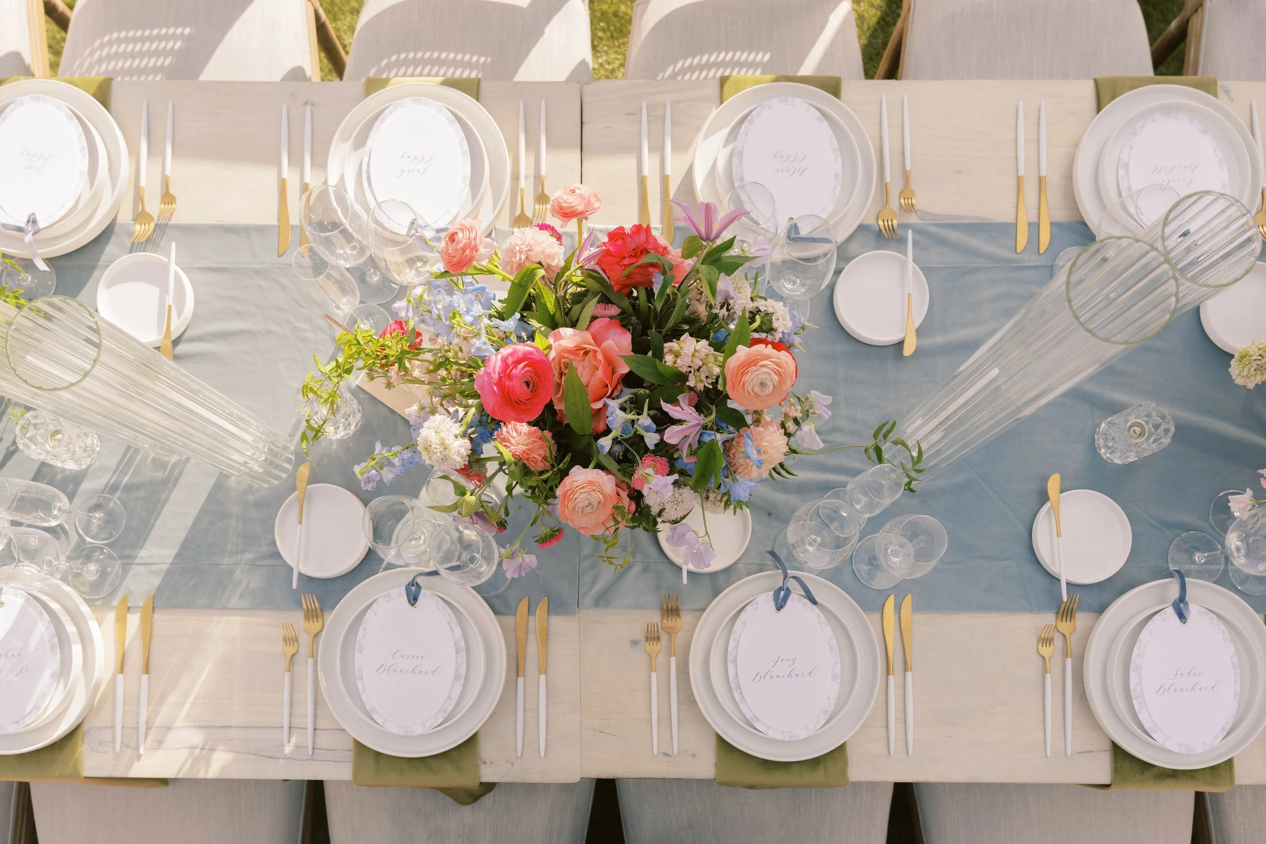Light blue velvet table runner with bold florals and oval menus at Four Seasons Scottsdale.