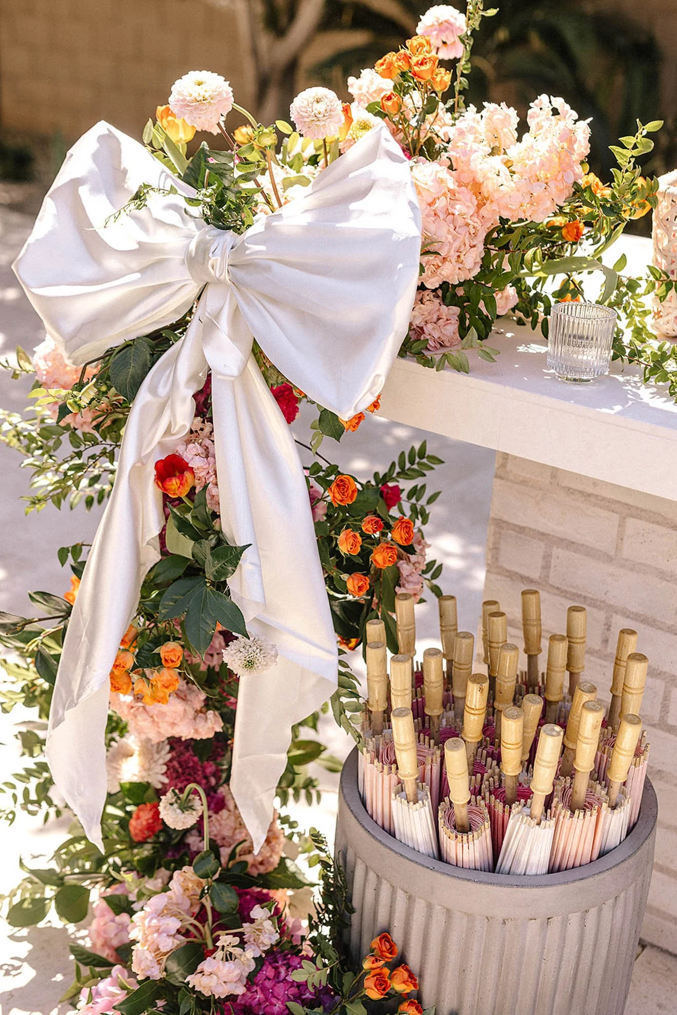 14.event-decor-bow-florals-umbrella.jpg