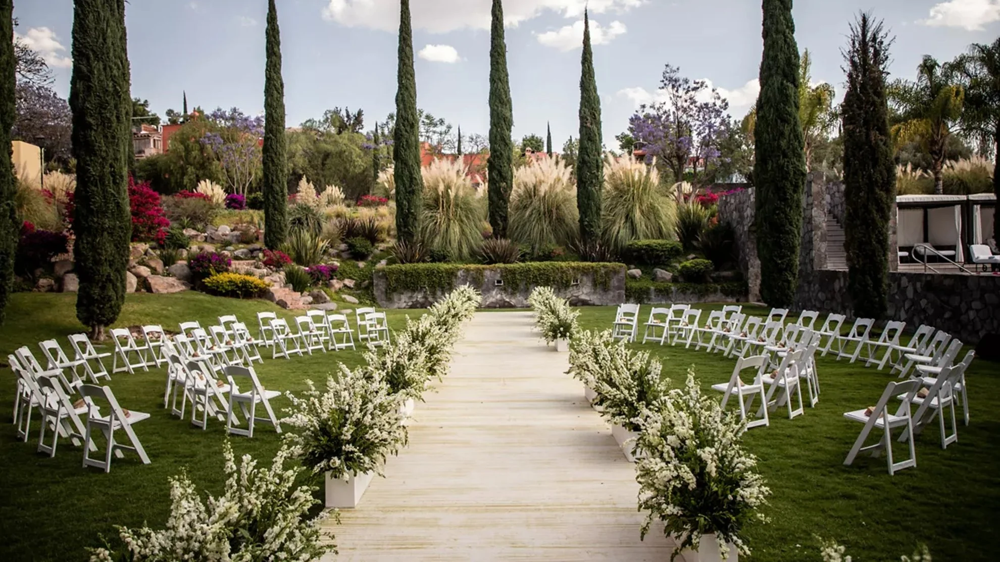 Rosewood San Miguel de Allende garden ceremony with modern florals, lush greenery, and refined layout at a luxury wedding venue in Mexico