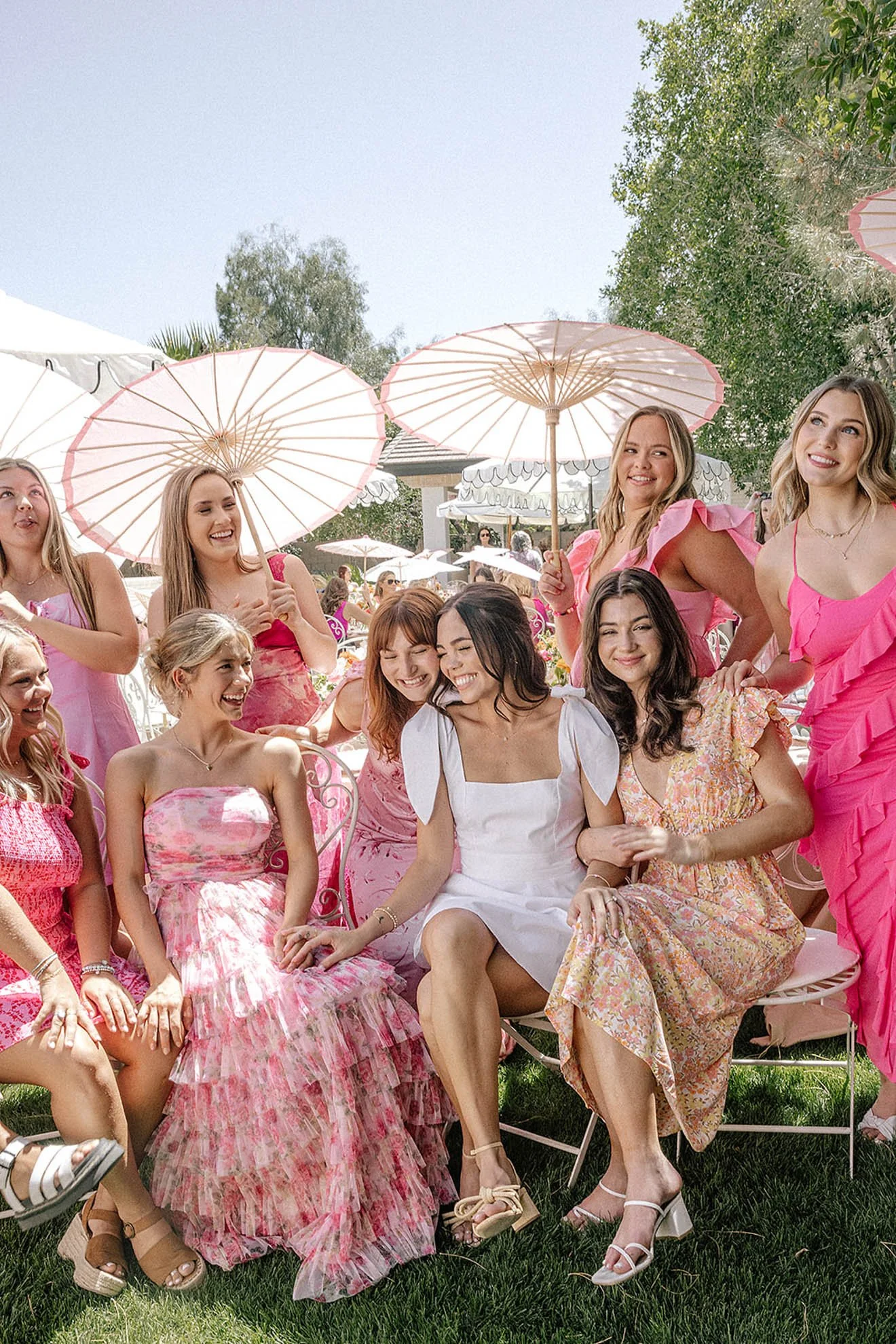 18.bridesmaids-in-pink-hugging-smiling.jpg