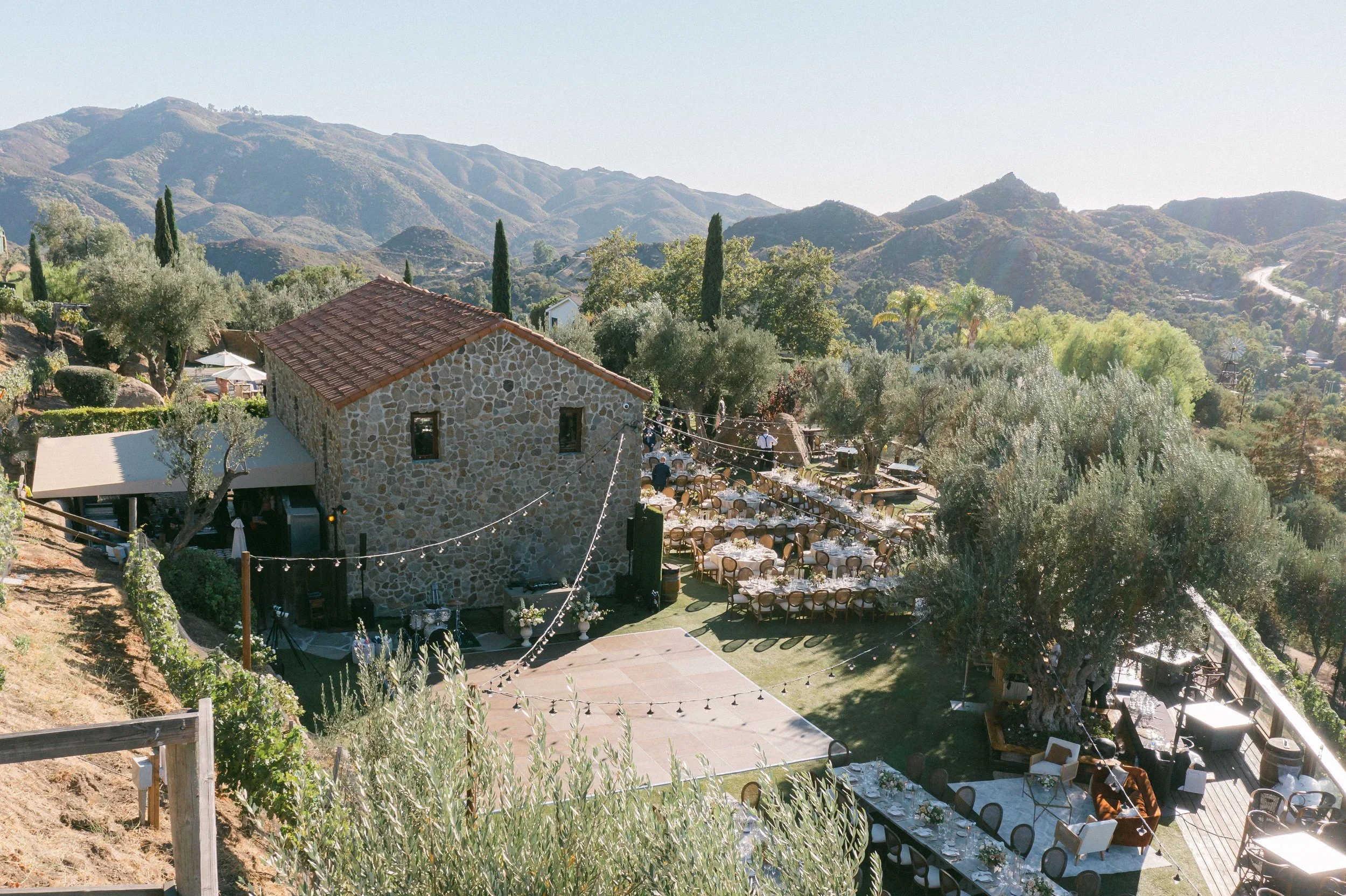 Cielo Farms Malibu wedding venue with sweeping mountain views and modern outdoor reception setup for a luxury wedding