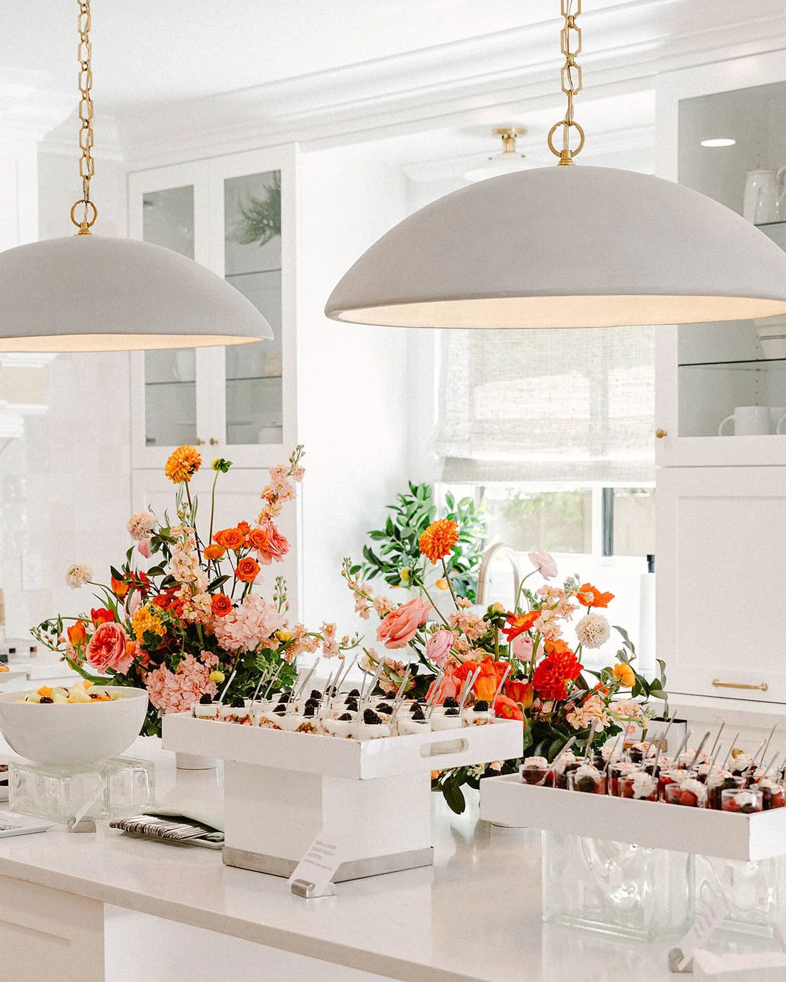 19.white-kitchen-event-flowers-and-treats.jpg
