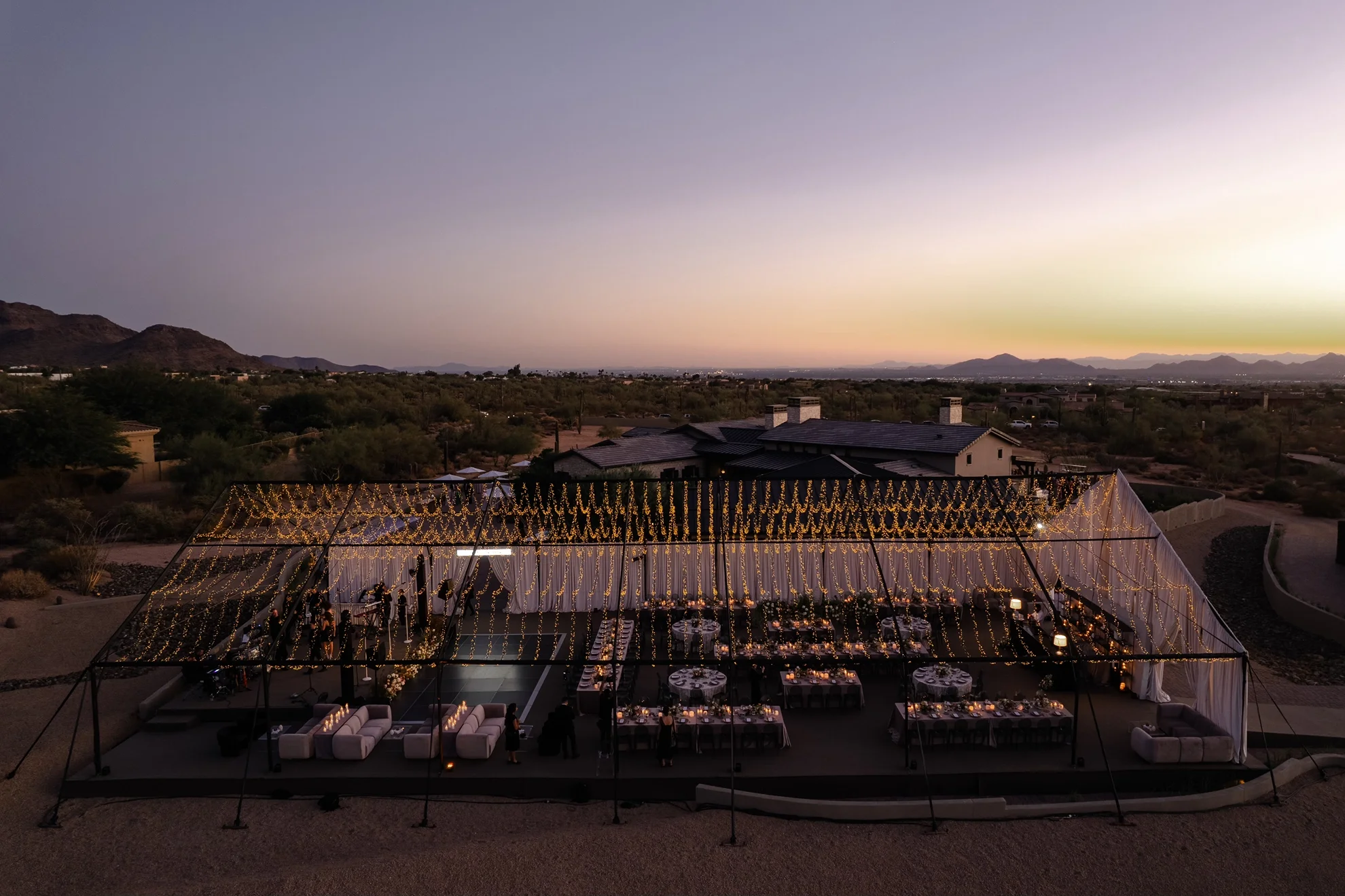 Open-air tented private estate wedding in Scottsdale with twinkle lights and residential-style design, planned and produced by Mandy Marie Events