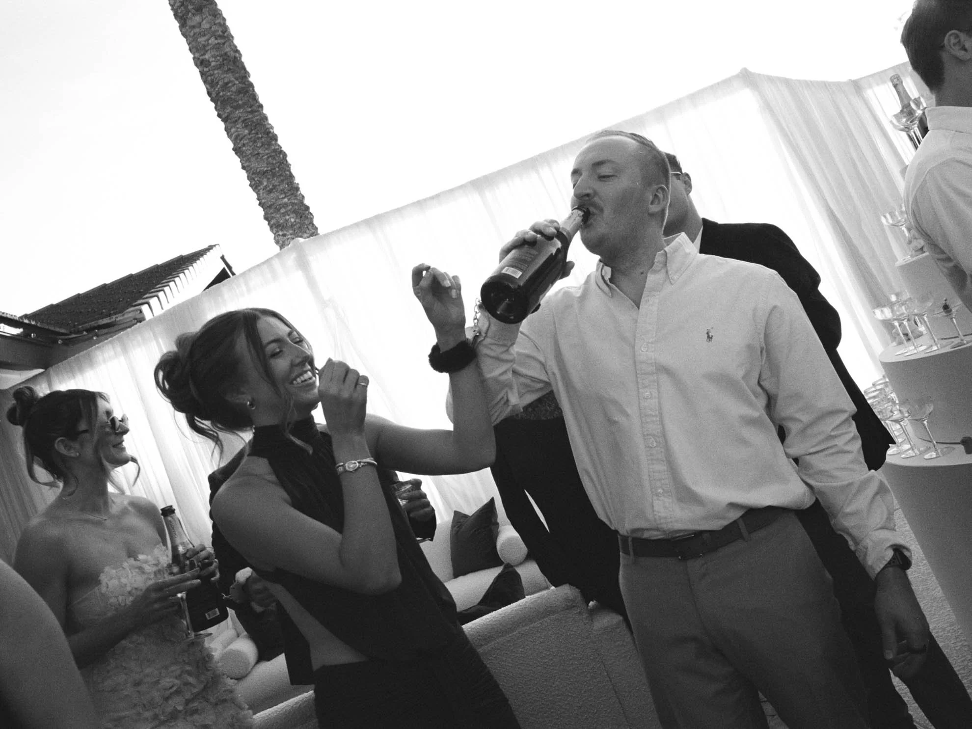 30guests-drinking-champagne-from-bottles.jpg