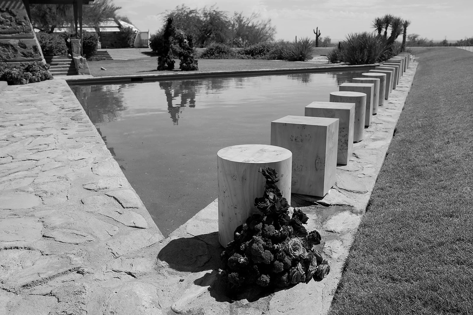 Outdoor wedding ceremony at Taliesin West featuring an angular fountain and scarlet design elements, creating a bold and immersive architectural setting