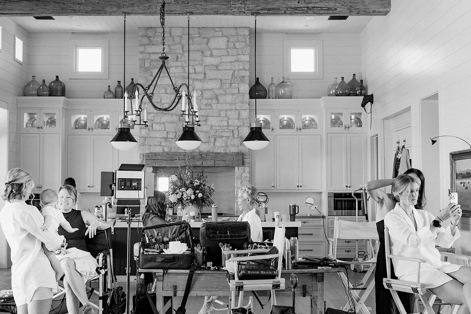 Bridal party getting ready with hair and makeup artists on wedding morning at Scottsdale venue.