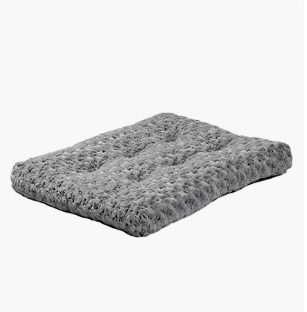 Gray fluffy pet bed on a plain white background.