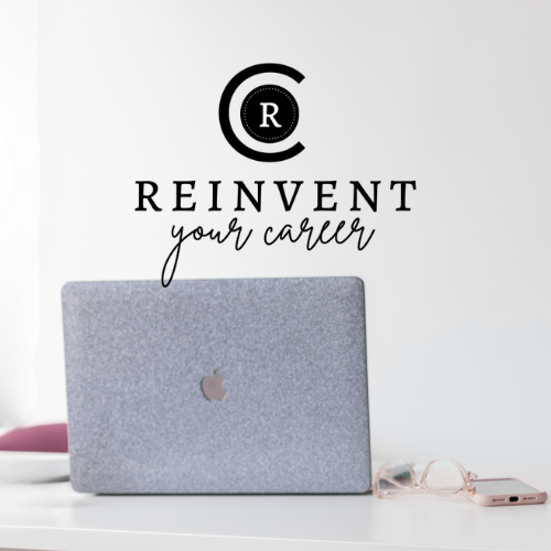 A white wall with a black logo and the text "REINVENT your career," a closed laptop with a felt sleeve, pink glasses, and a pink phone on a white desk.