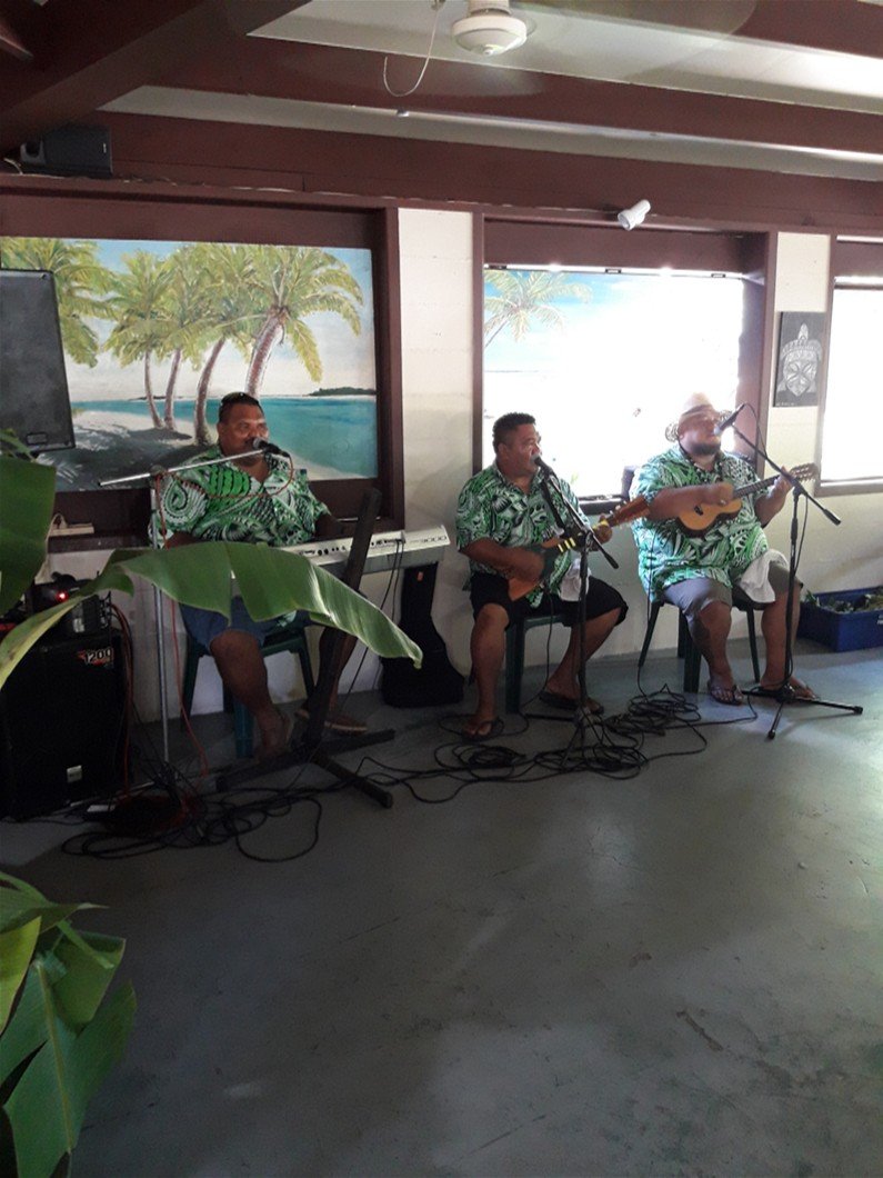 Three singers in a Island string band on Rarotonga
