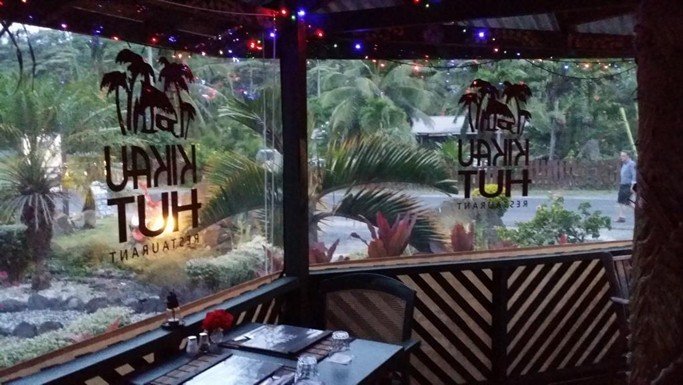  Kikau Hut Restaurant on Rarotonga with advertising on windows