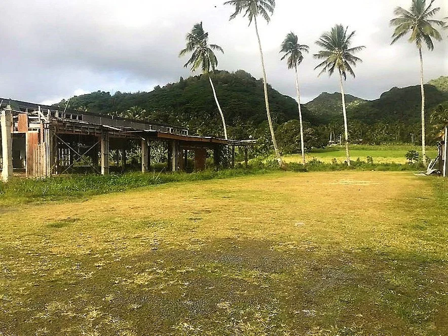 Vacant land on Rarotonga , close to Edgewater Hotel , Cook Islands with derelict building in background