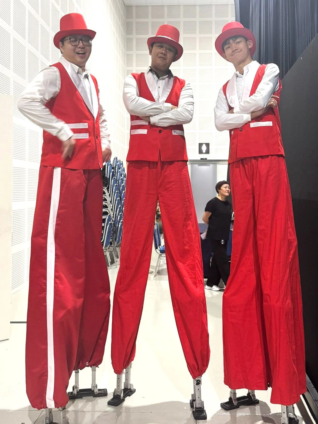 Red-and-White Vest Stilt Walker
