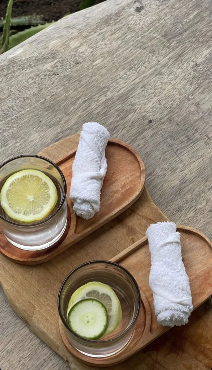 People lifting dumbbells during a workout session at a gym or fitness class.