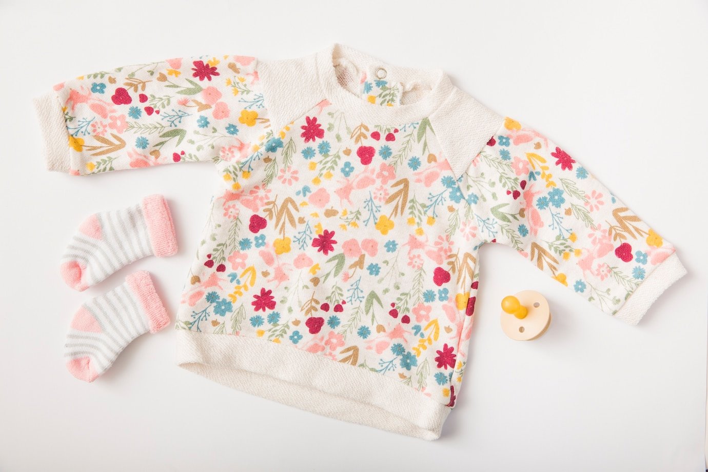 baby-s-clothing-socks-with-pacifier-isolated-white-background_23-2147900717.jpg