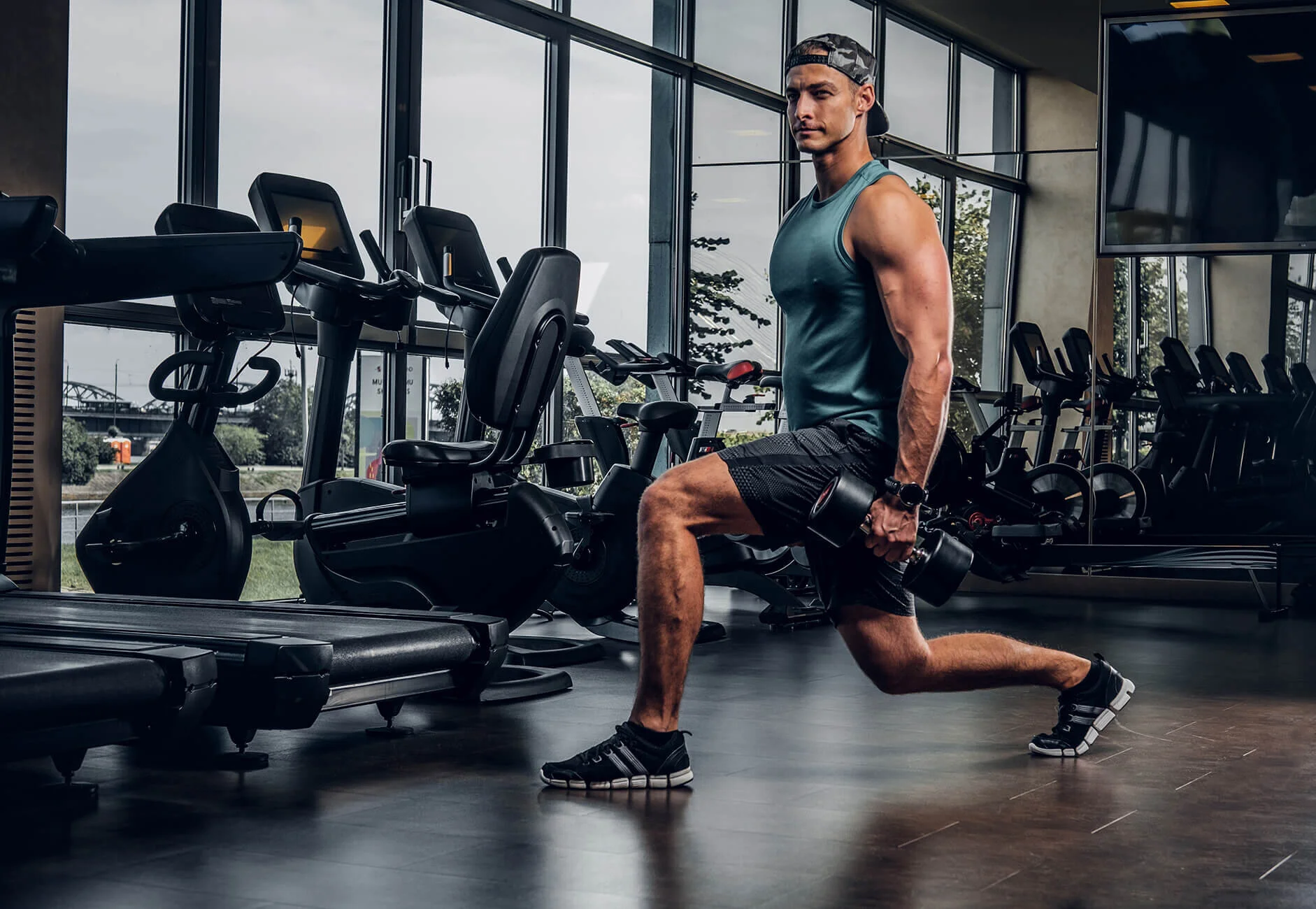 man-has-training-with-dumbbells-at-gym-FFCU7XS.jpg