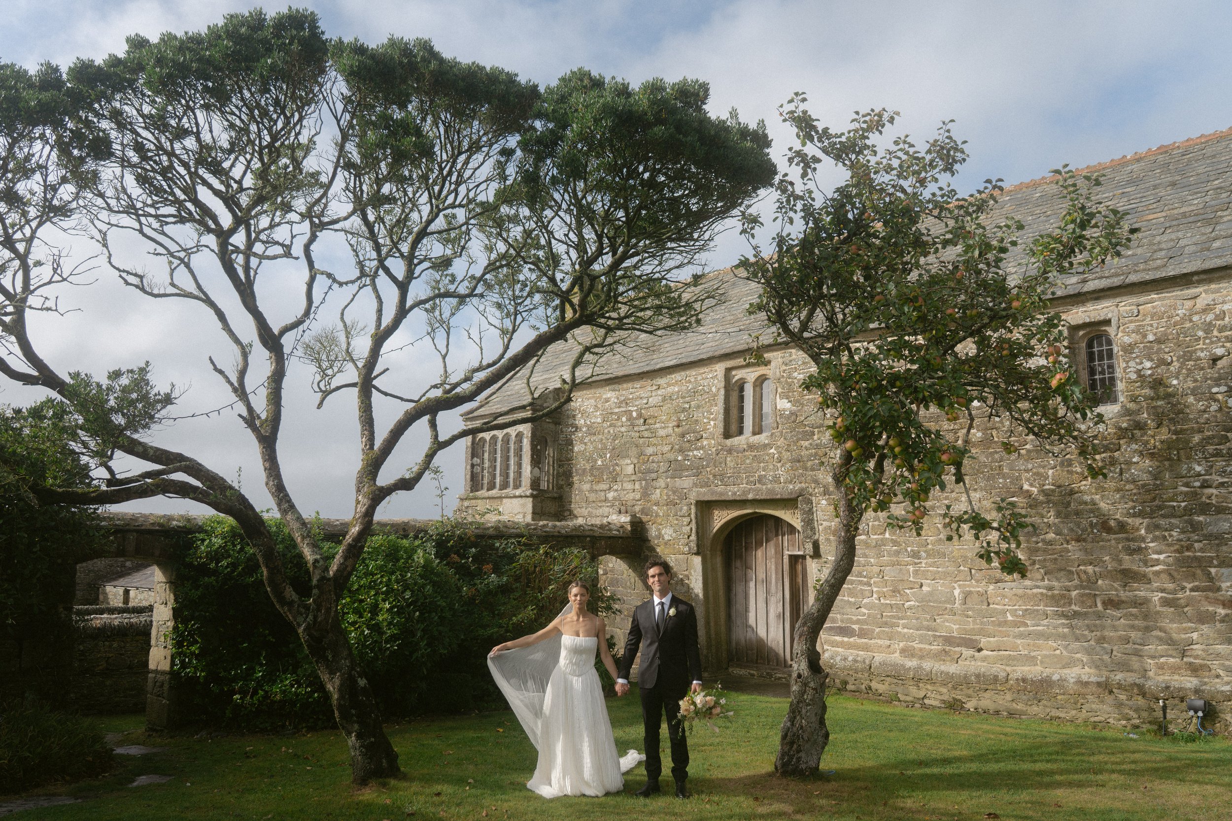 A Light &amp; Airy Champagne &amp; Oysters summer wedding at Roscarrock with the bride wearing Danielle Frankel Studio