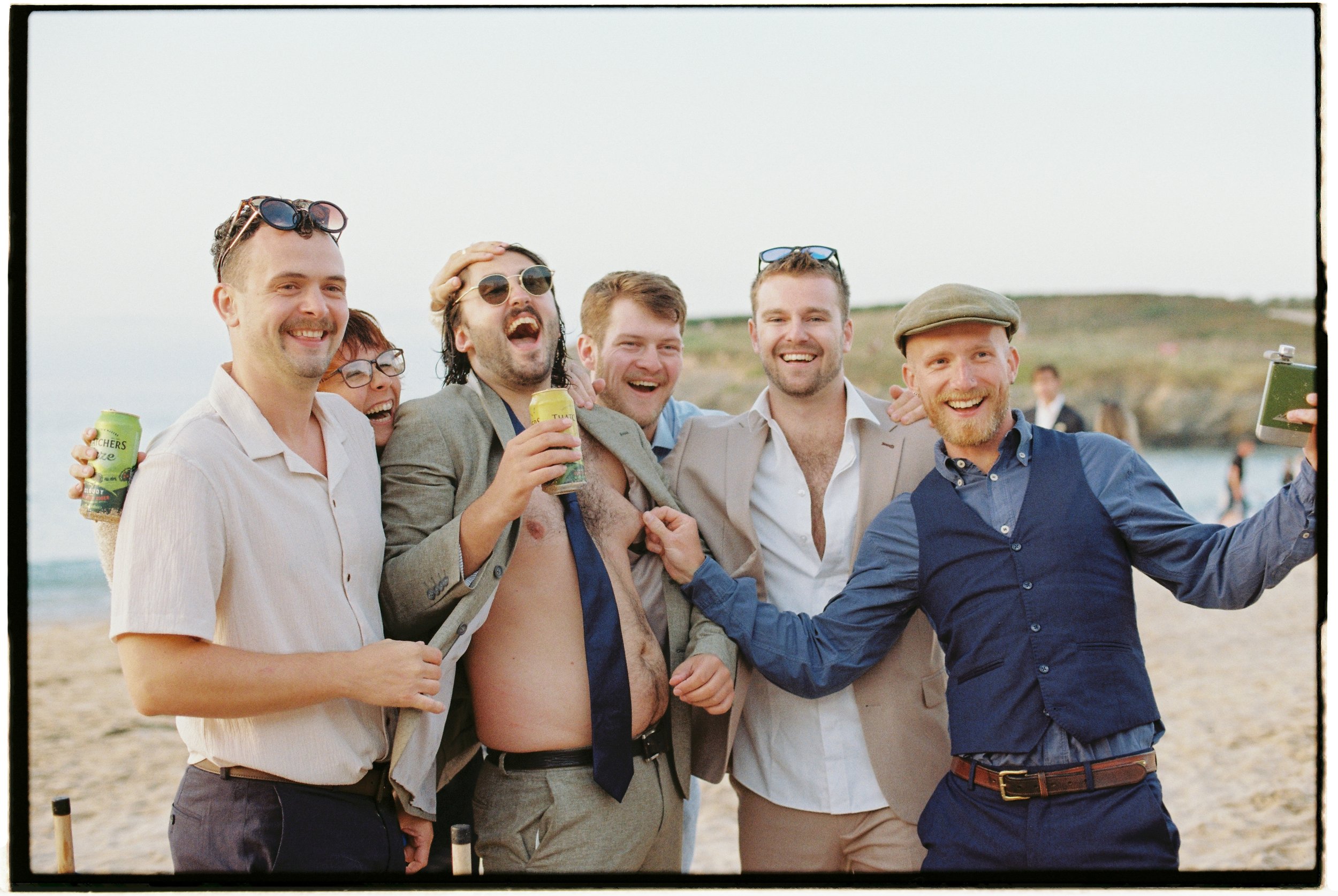 candids captured on film at a cornwall beach wedding by hybrid wedding photographer in the southwest