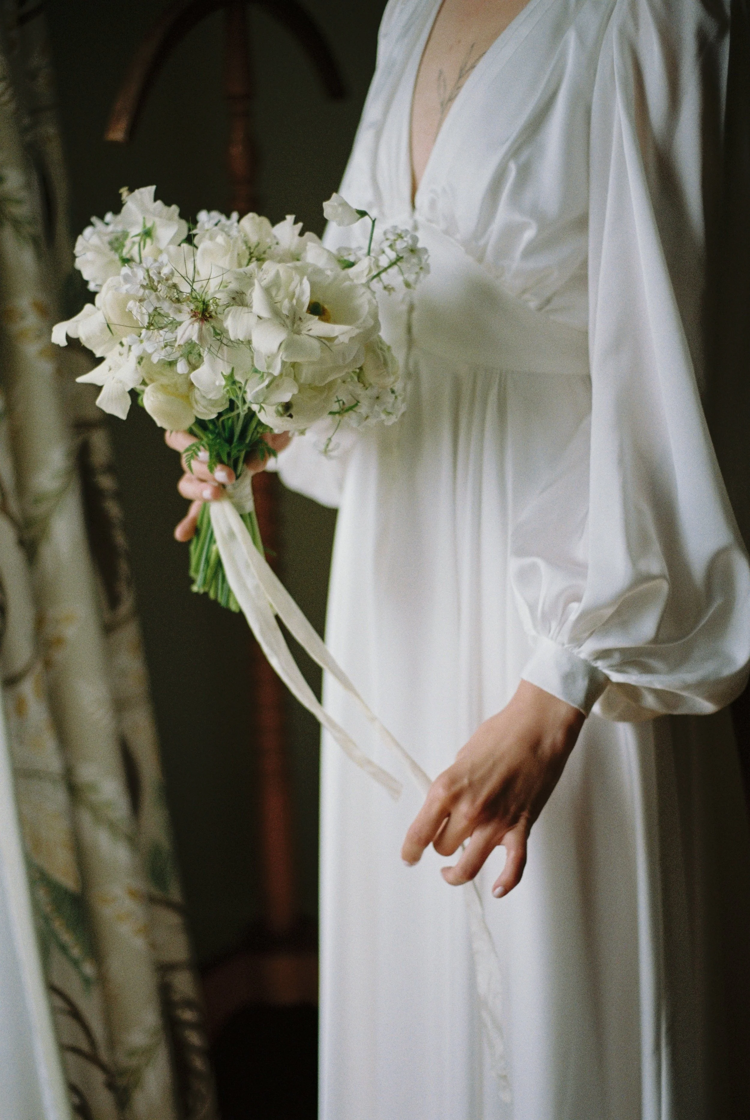 crisp white bouquet and balloon sleeve details for an elopement at hotel tresanton in st mawes cornwall