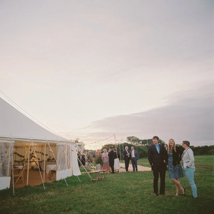 outdoor wedding in cornwall with summer sunset skies
