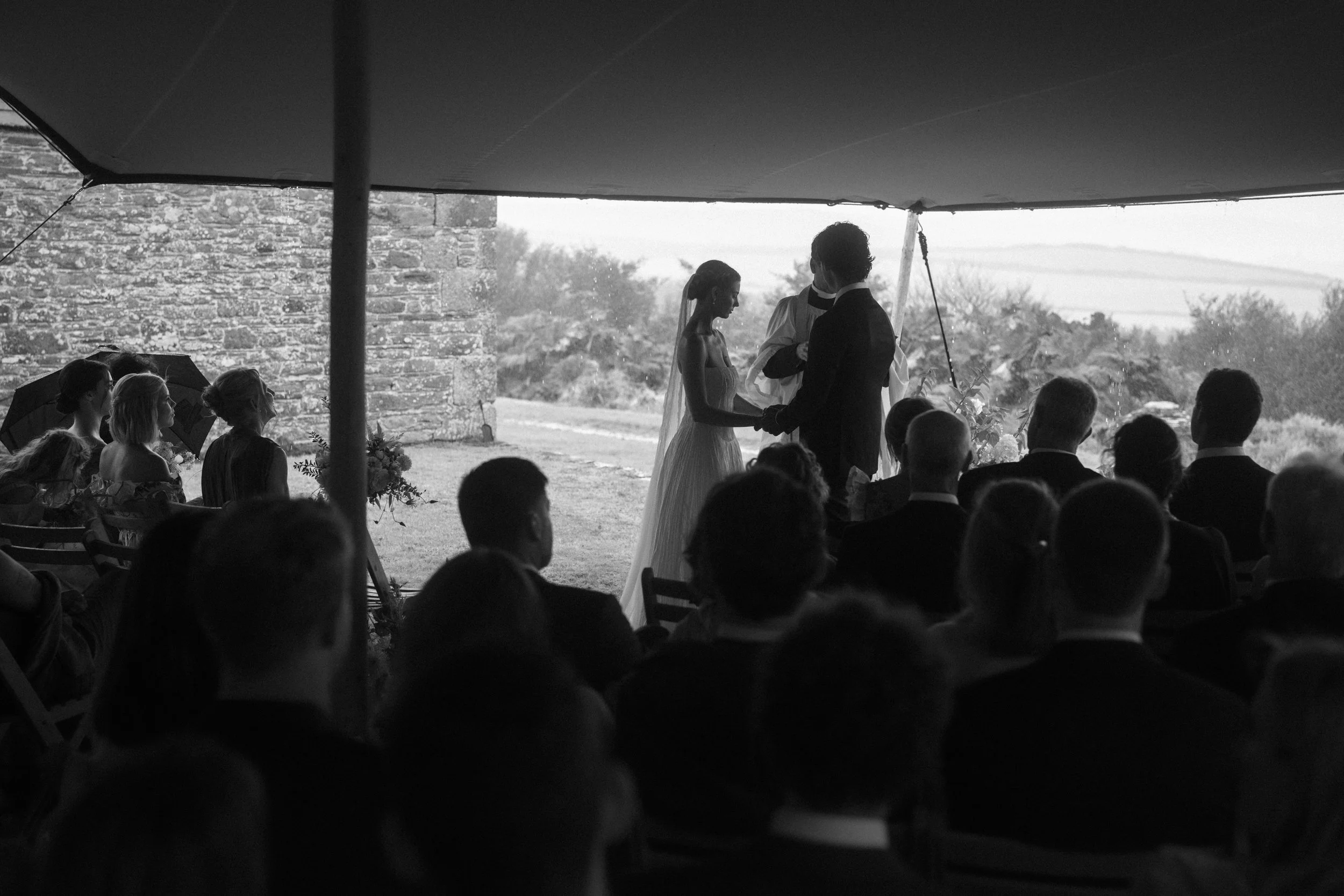 moody and atmospheric candid moments at a rainy cornish wedding
